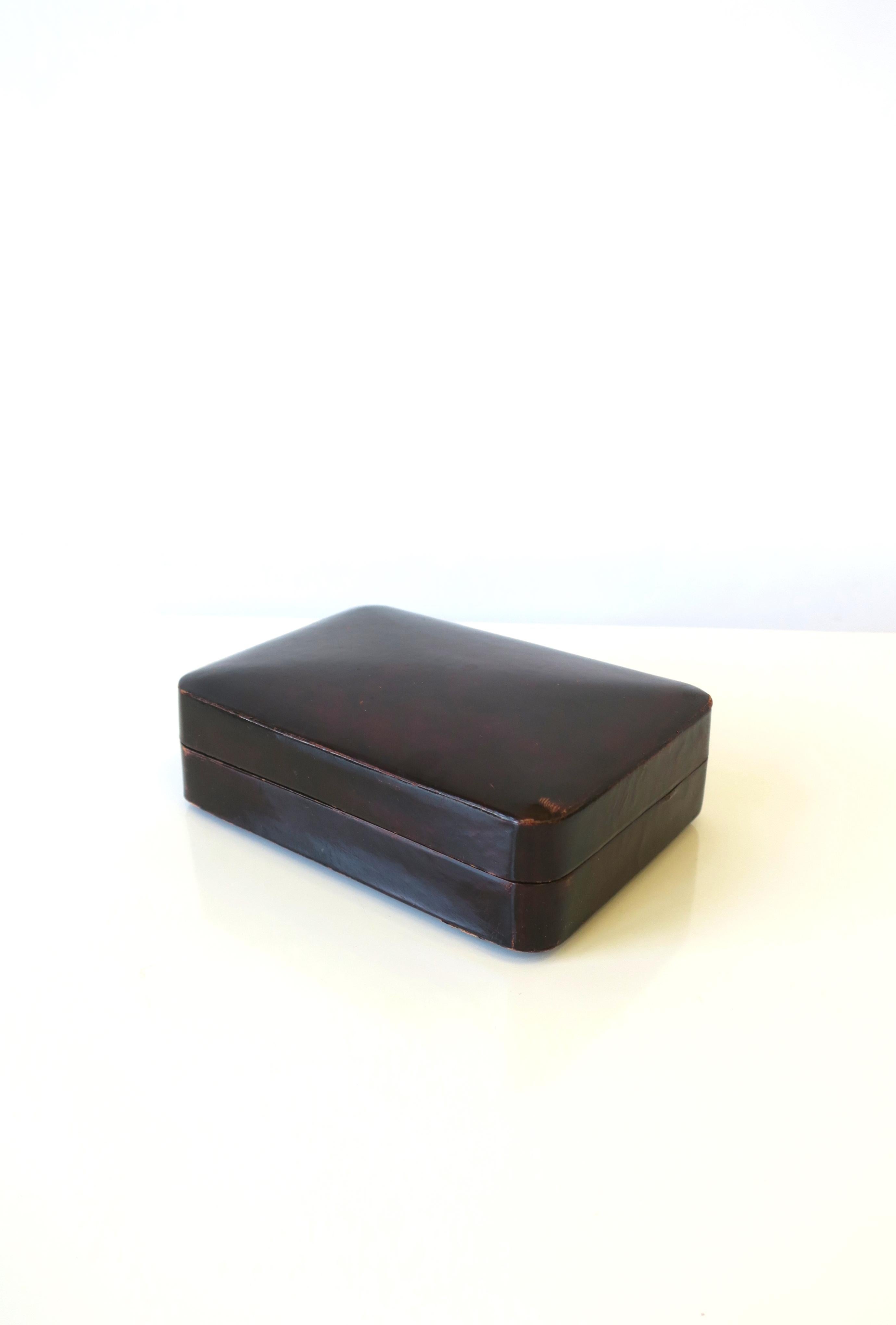 A beautiful vintage Italian all leather jewelry box in a rich dark brown, circa mid-20th century, Italy. Dimensions: 3.5