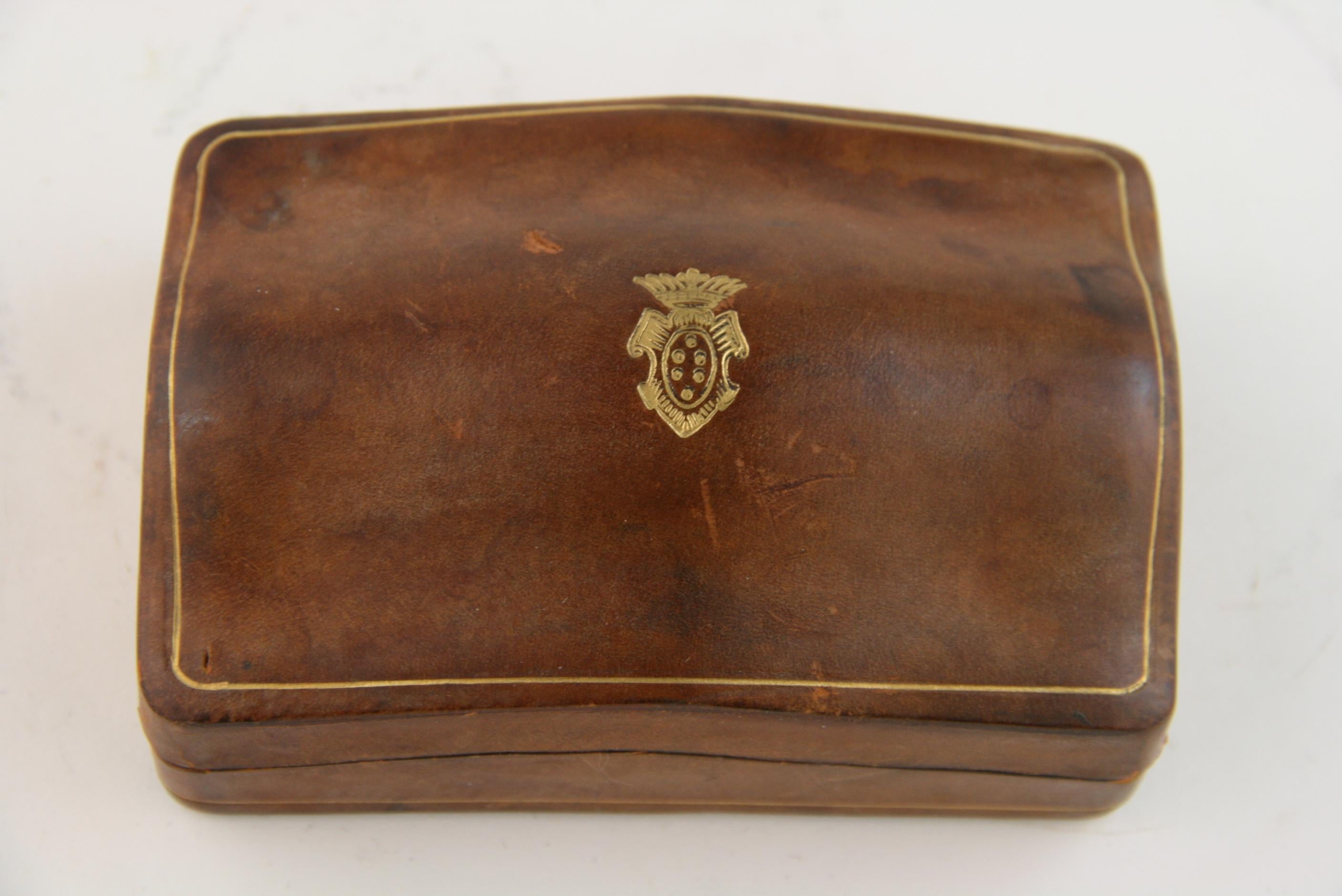 8-250 Italian handmade leather box with gold embossed edge and crest.