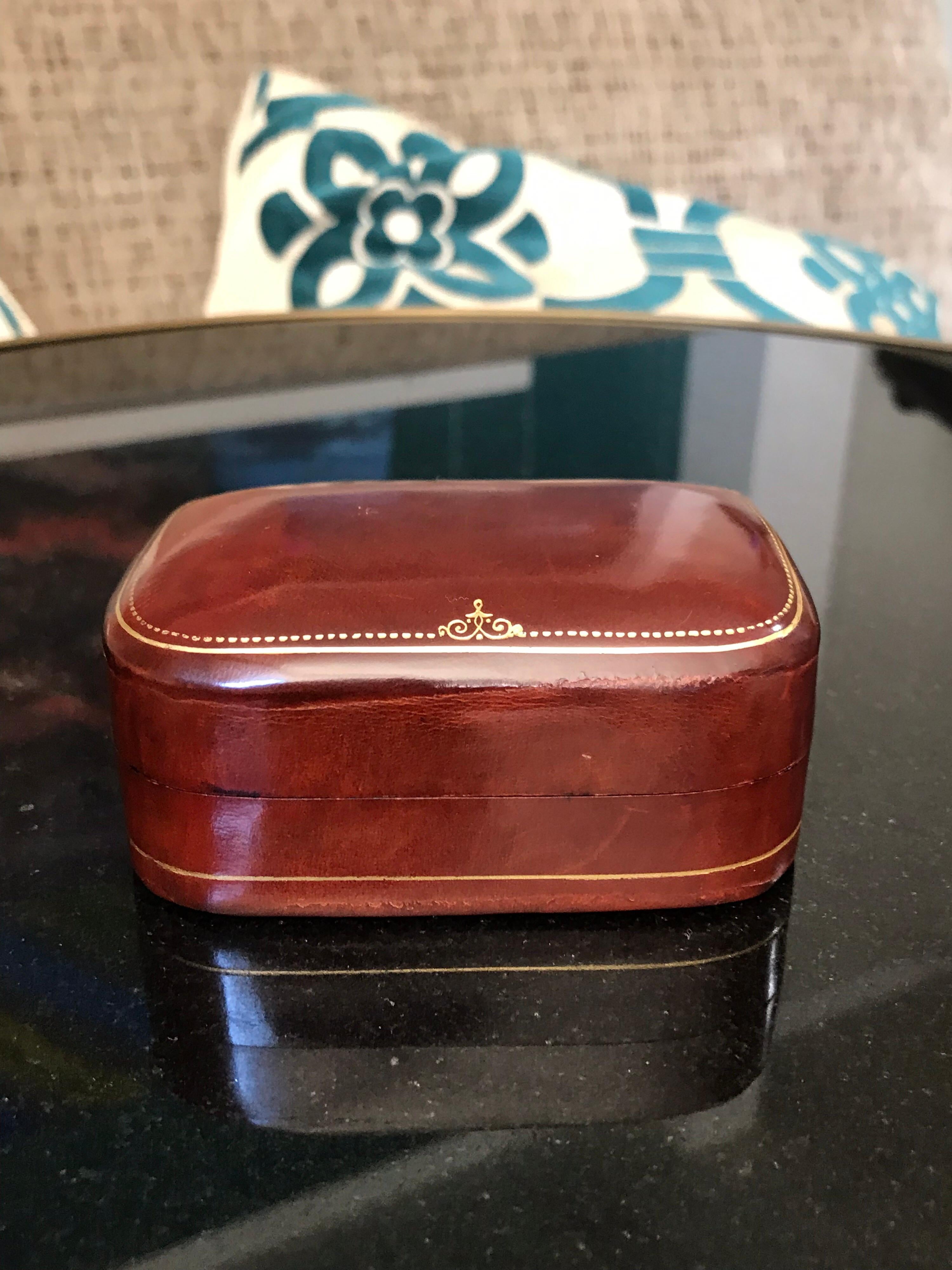 A supple and rich vintage Italian calfskin jewelry box having a back sewn hinge and gilt embossed details all around it. Earrings, cufflinks or what have you, this stylish little storage box will be loved for years to come. Very tactile feeling and