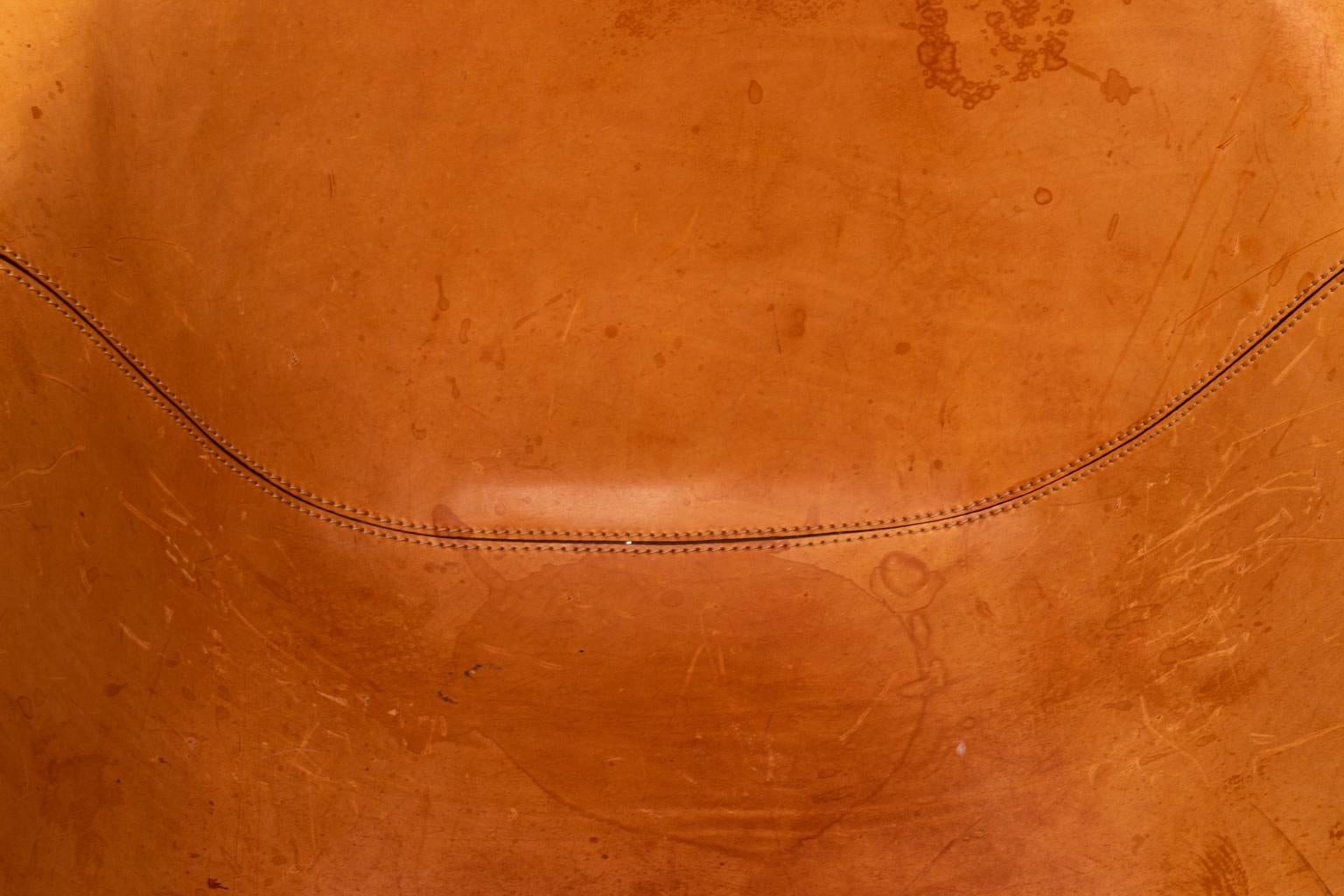 Italian leather Max Alto designed Antonio Citterio armchair on a metal base. Please note of wear consistent with age including stains to the leather.