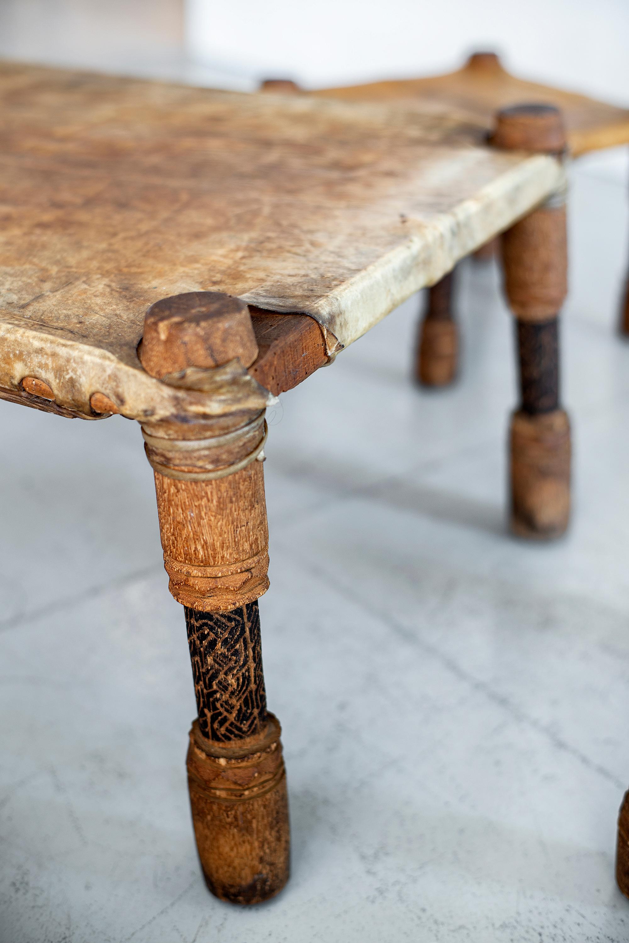 African Leather Table and Stools In Fair Condition In Beverly Hills, CA