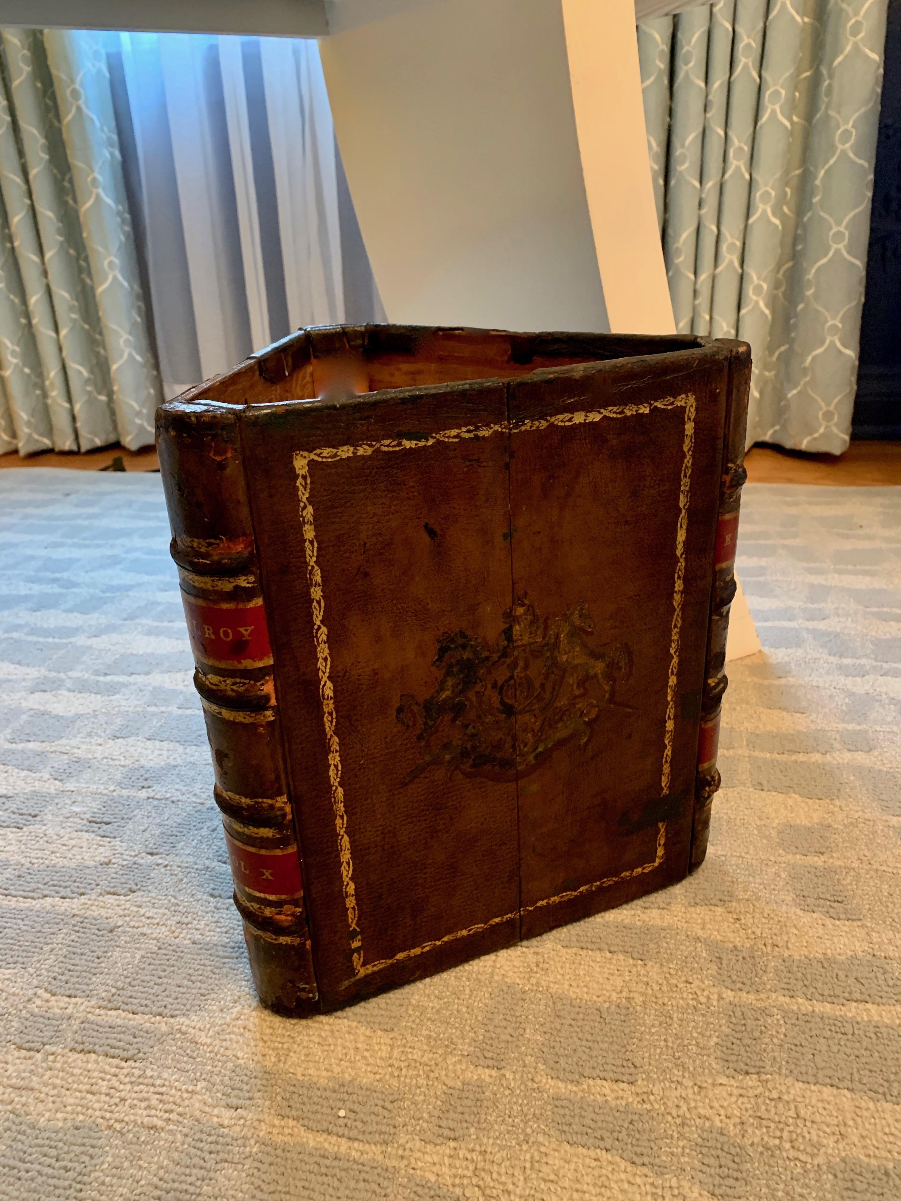 A handsome Italian leather waste basket in a triangle shape depicting leather bound books and is a perfect compliment to the professional or home office, den or library! Also a nice addition to the Childs room. The piece is beautifully patinated.