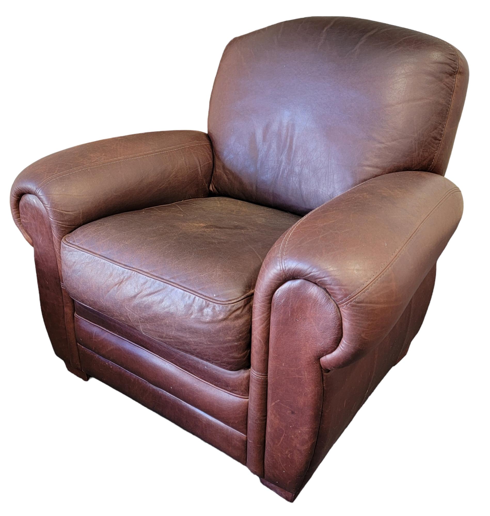 Italian Leatherette Club Chair and Ottoman, Wonderful brown color with wear to match. Wooden feet. Comfortable and soft to when sitting.

 Club chair measures approx - 41w x 35d x 37h and the Ottoman measures approx - 25 x 25 x 16
