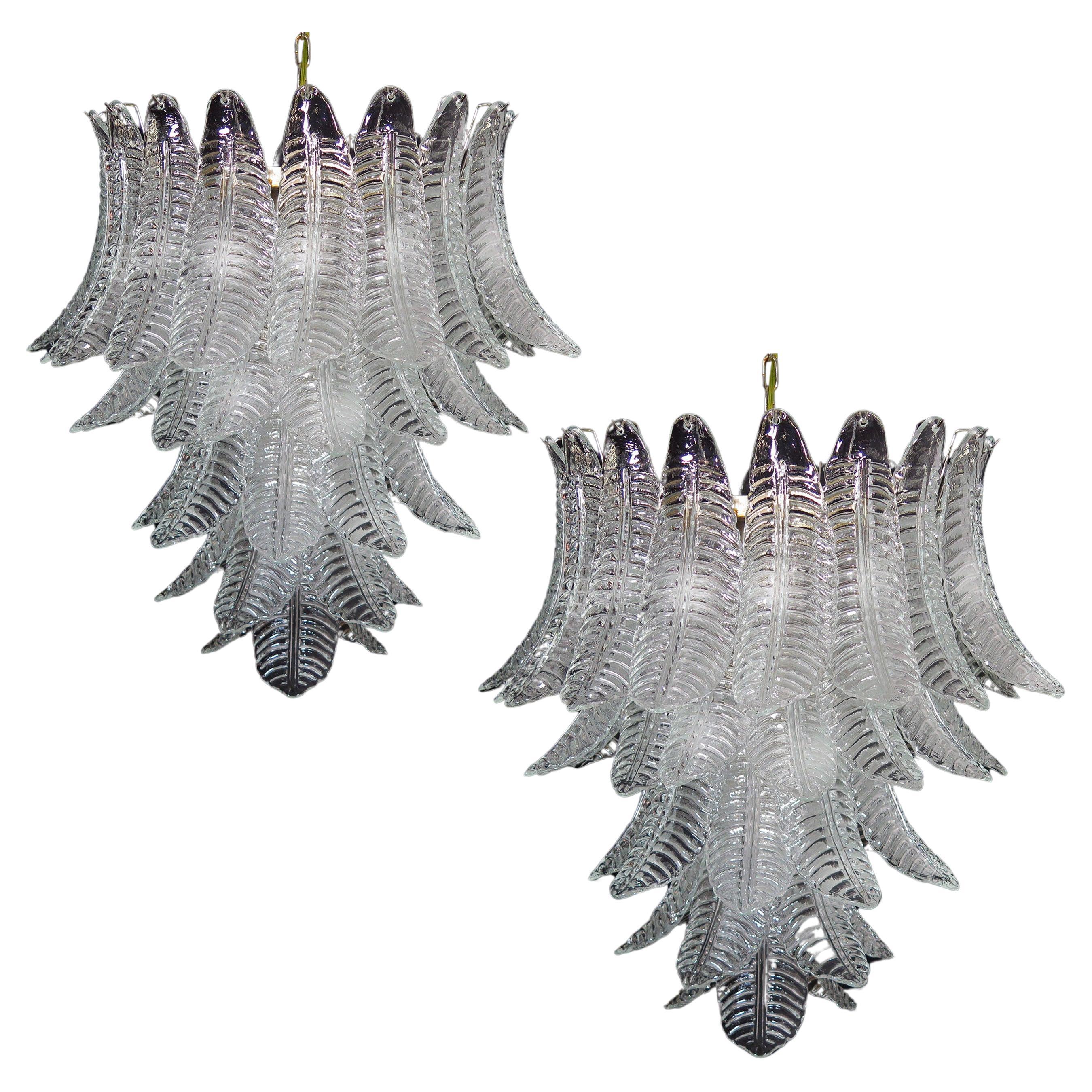 Pair of beautiful and huge Italian Murano chandeliers each composed of 52 splendid transparent glasses that give a very elegant look. The glasses of this chandelier are real works of art, the weight of this chandelier is 45 kg.

Dimensions: 61
