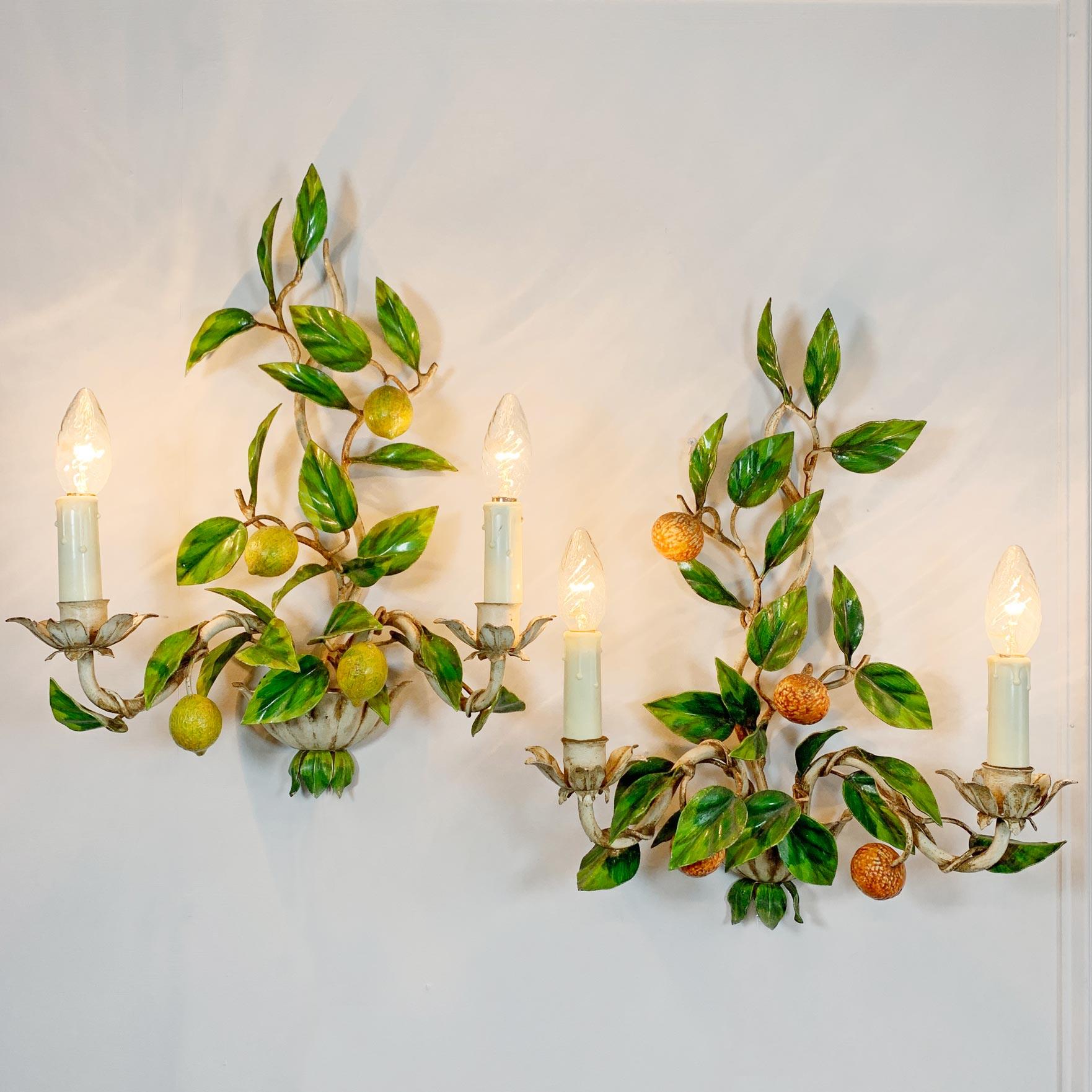 A delicious pair of hand painted Italian Lemon and Oranges fruit and leaf toleware wall lights. In superb vintage condition, these 1950's lights are in full working order and PAT Tested. 

Price is for the pair.

Each light has two E14 (small