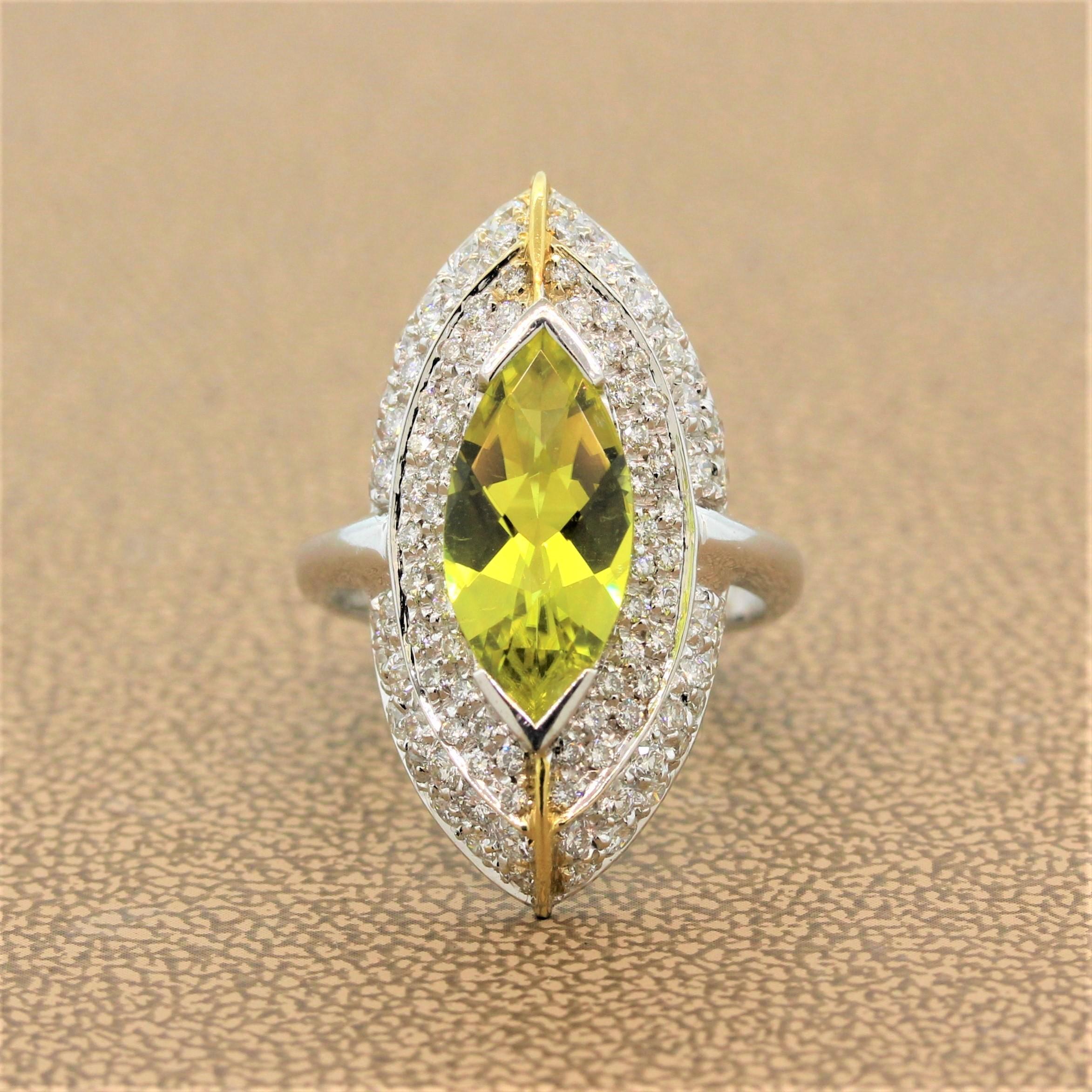 An Italian made navette ring featuring a 2.29 carat lemon quartz with a vibrant yellow color. The marquise cut lemon quartz is surrounded by 1.21 carats of round cut pave set diamonds in an 18K white gold setting with two stripes of 18K yellow gold