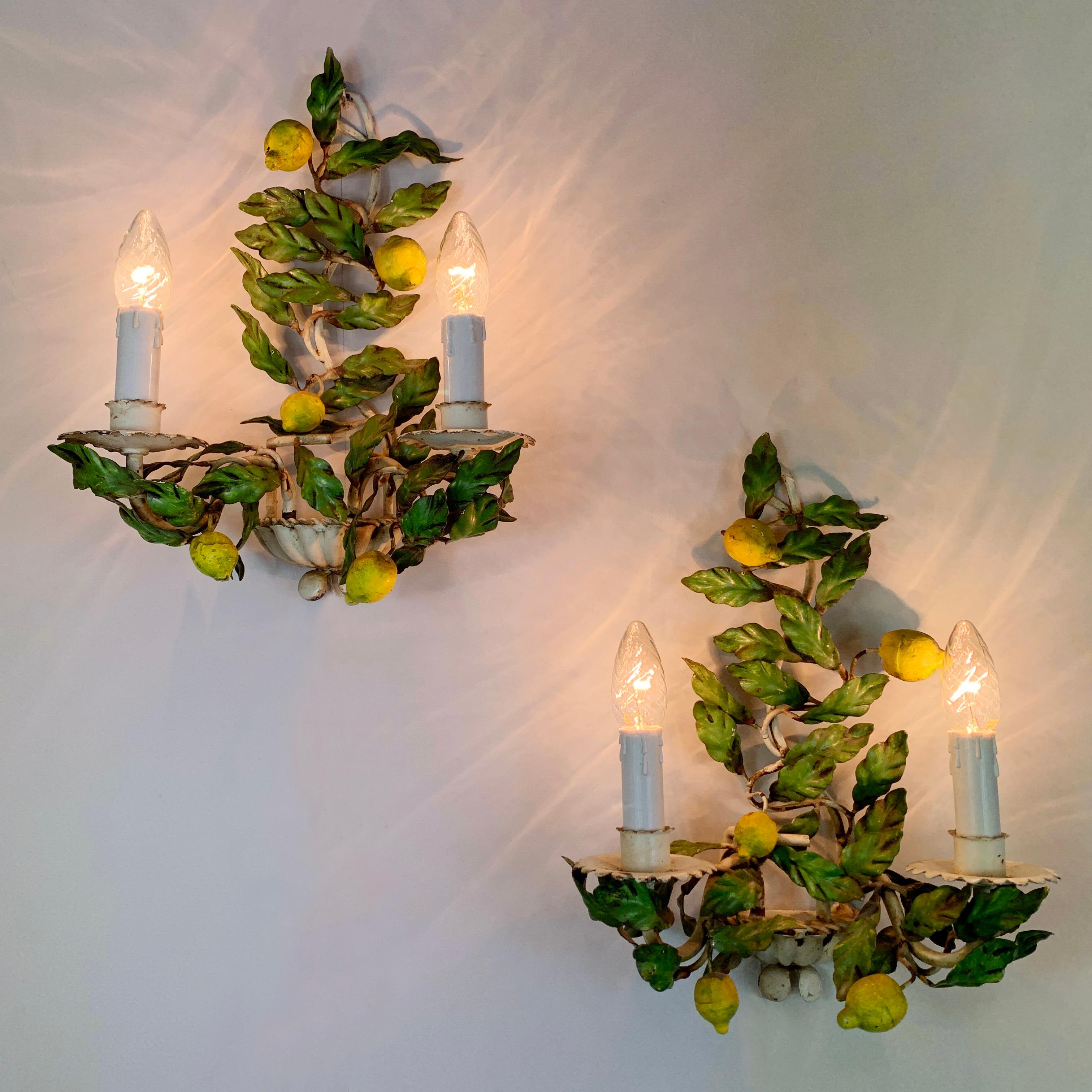 A delicious pair of hand painted Italian Lemon fruit and leaf toleware wall lights. In superb vintage condition, these 1940's/50's lights are in full working order and PAT Tested. Price is for the pair.

Measures: Height 40cm x width 31cm x depth