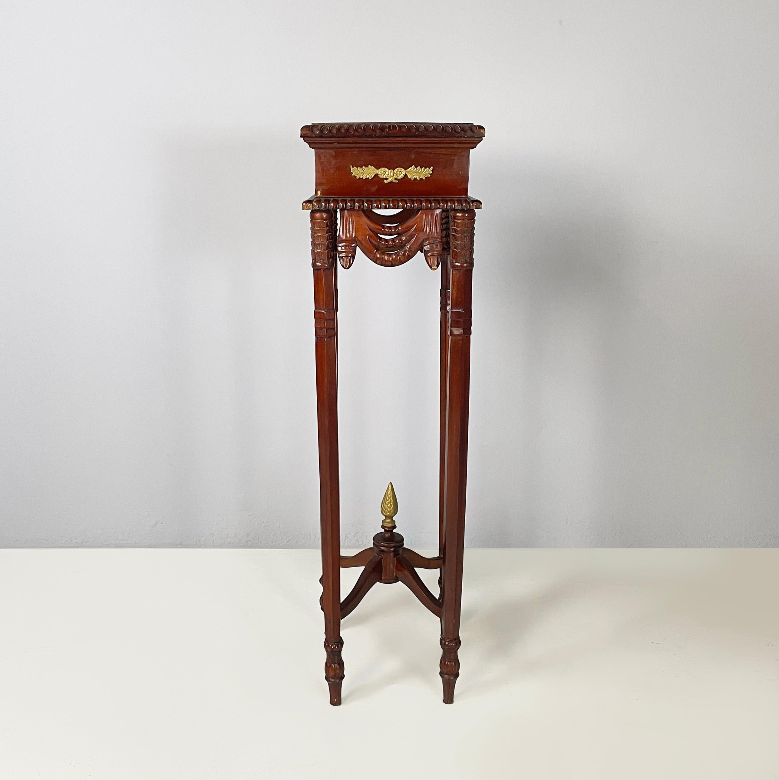 Italian Liberty style Wooden square high column with brass details, 1940s
Square wooden high column. The top has a decoration on the profile and brass decorations with leaves on the sides. The legs are finely worked and slightly curved inwards. In