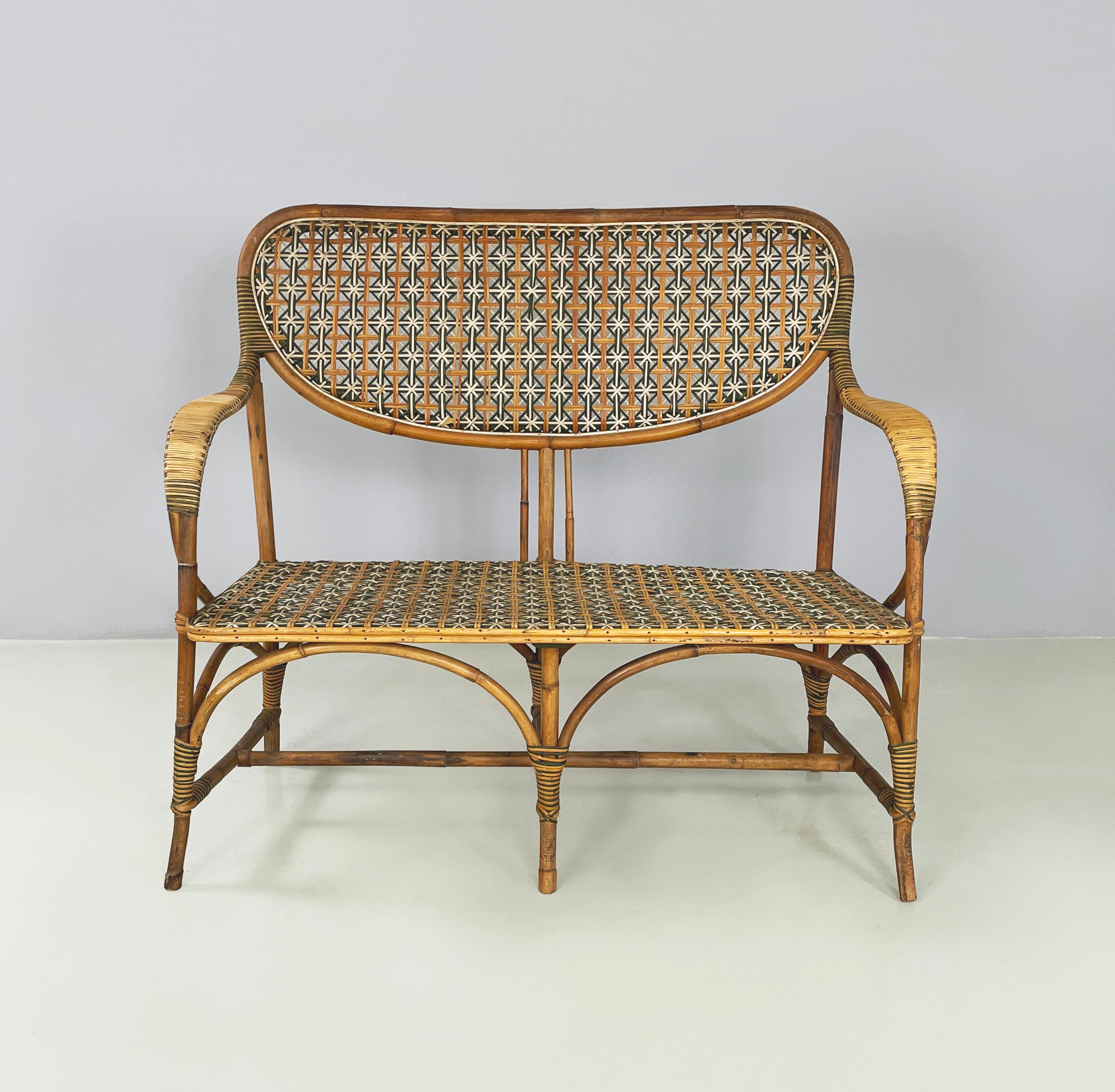 Italian Liberty Two-seater outdoor bench in rattan from Palazzo Falconi, early 1900s
Two-seater outdoor bench entirely in woven rattan. The backrest is in rattan with brown, white and green wicker weaves with a star pattern. Curved armrests. The