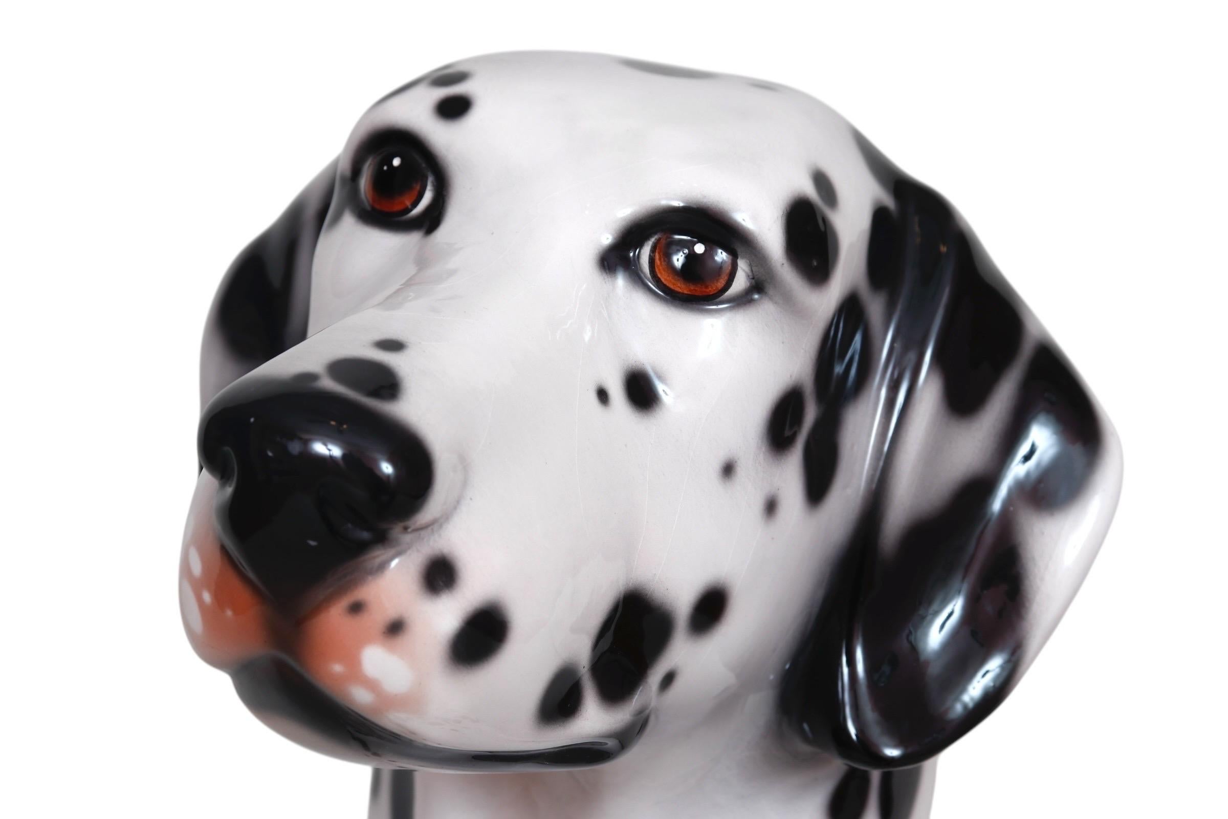 A life size sitting porcelain Dalmatian, made by Italian company Ceramiche Bell'Europa of Marostica and Cartigliano, circa 1999. Cast in a true to life manner with the head turned to the left of the body, tilted in an attentive way. Subtle shapes