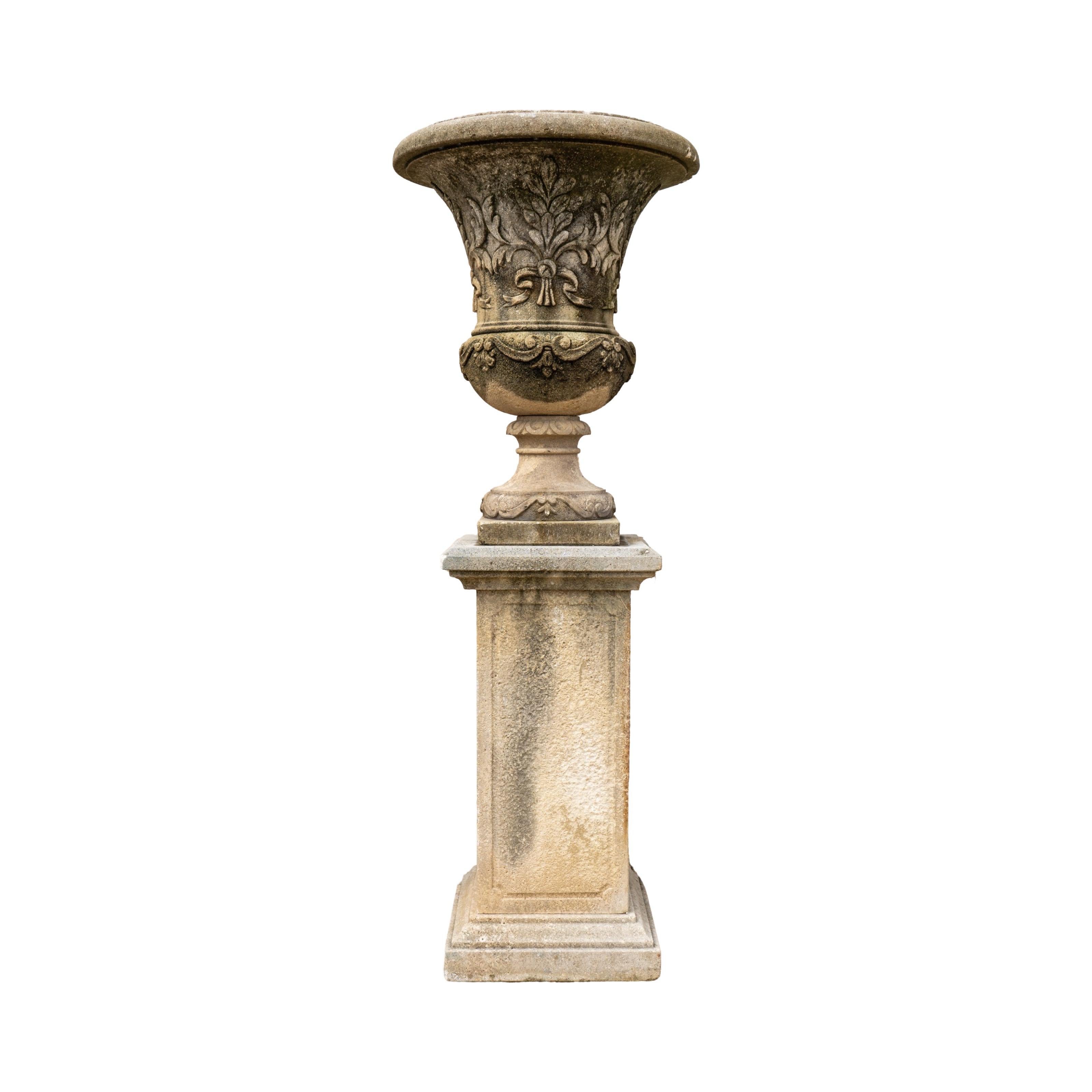 This Italian Limestone Planter with Base offers a stunning and intricately designed piece for your outdoor or indoor gardening needs. Made from reclaimed limestone, this planter boasts a unique floral and arch lining carving, adding classic charm to