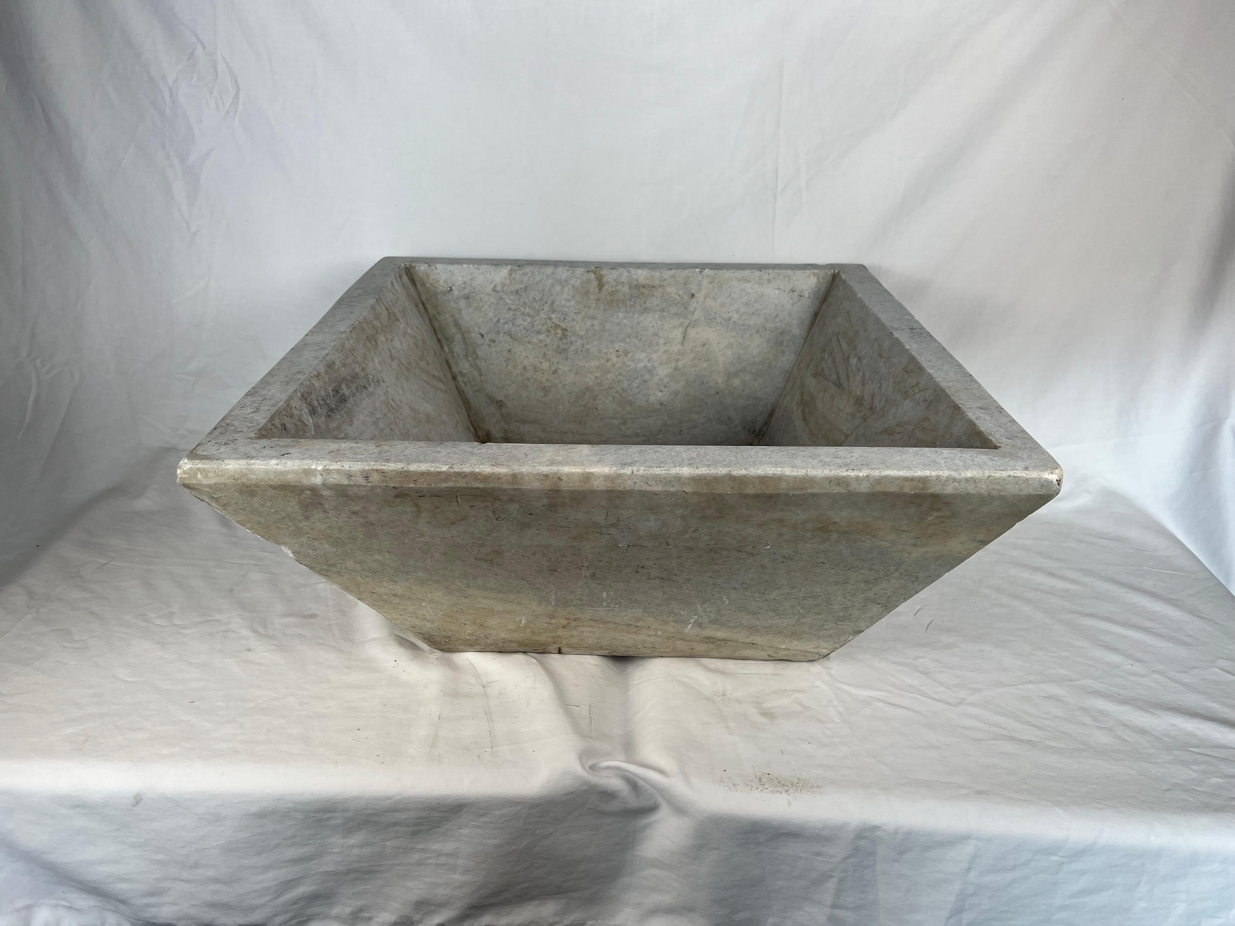 Italian square shaped limestone sink in beautiful subtle shades of cream, gold & gray.
