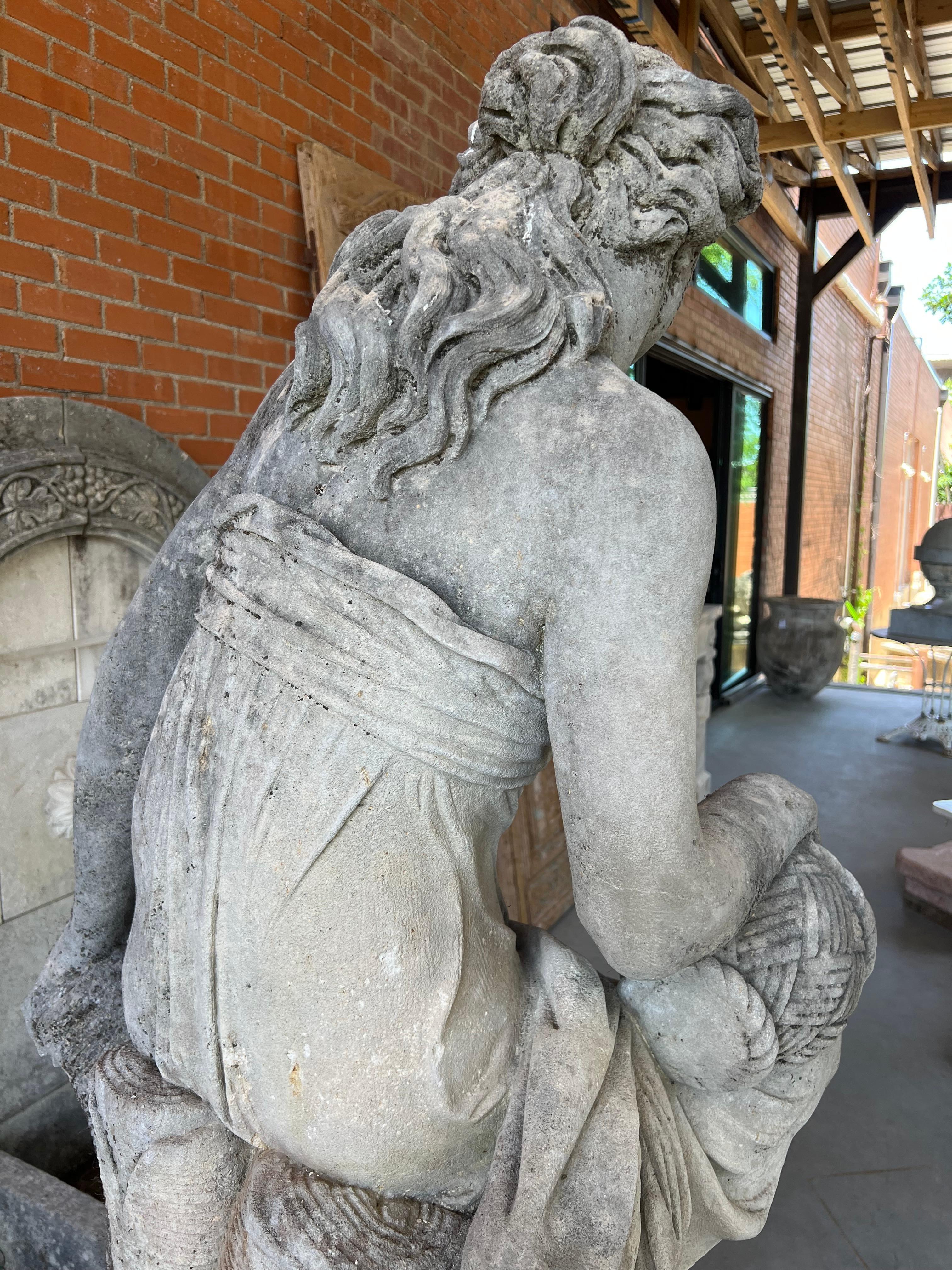 More information coming soon…

A beautiful depiction of the Roman goddess, Flora (her Greek counterpart is Chloris), this hand-carved Italian limestone statue depicts the youthful deity sitting on a tree stump, with a basket of flowers on her knee. 