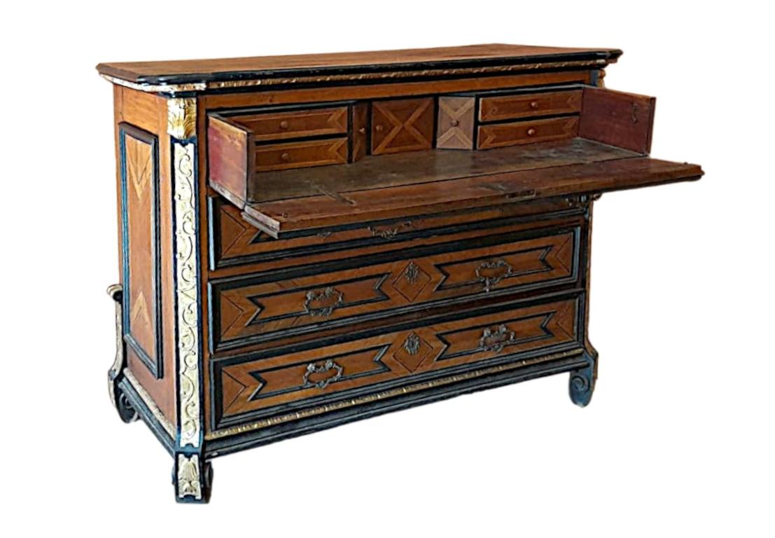 Italian (Lombard) dresser, mid-1700s, made of walnut. 

Antique cabinet with ebonized frames and gilt friezes.
Opening the flap on the first dresser reveals six internal drawers and a central flap inside.
Drawers and ashlars on the sides are