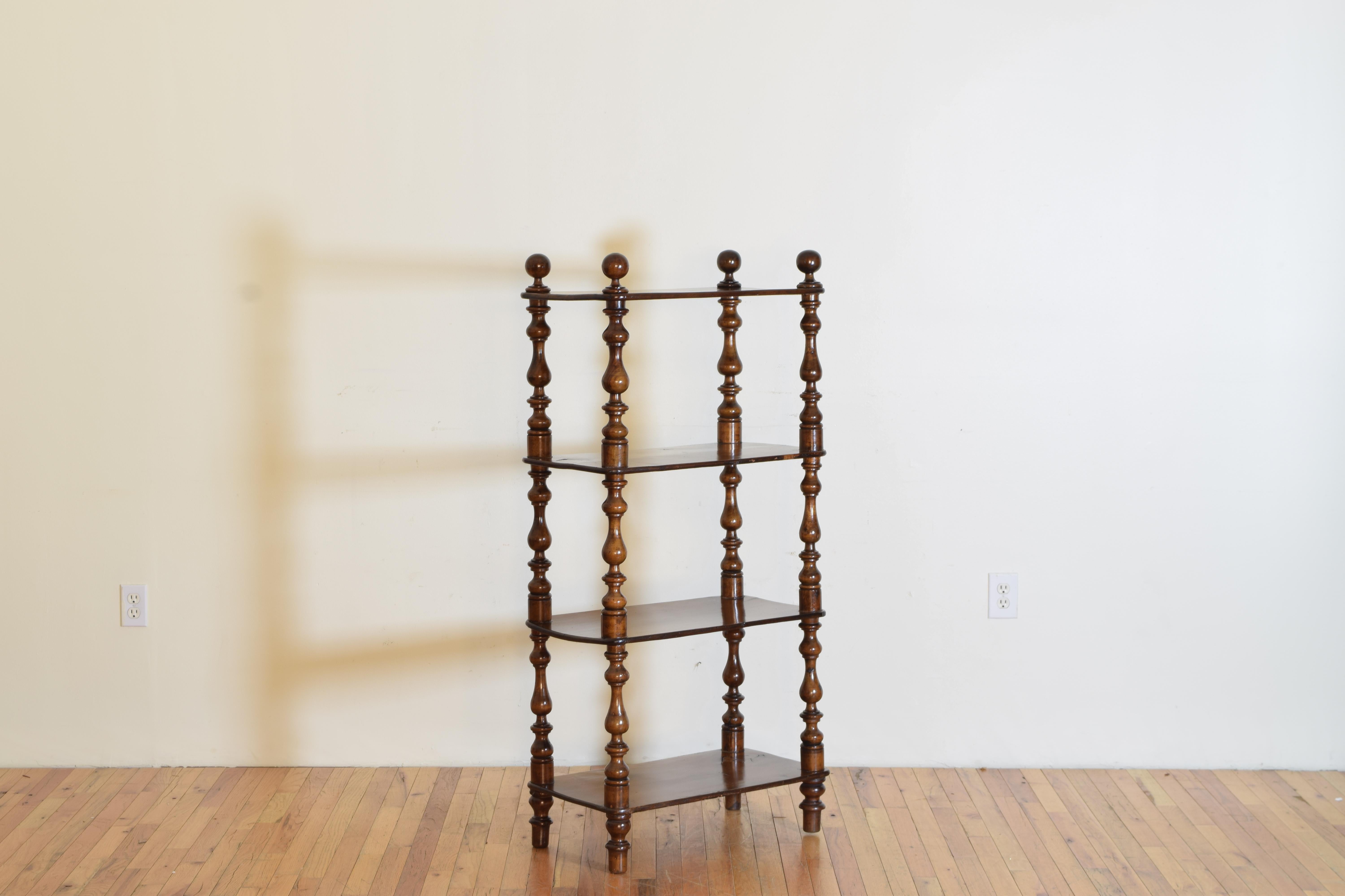 having four levels the rectangular surfaces with rounded corners and supported by four bobbin turned posts, elegant in proportion and structurally strong and level.