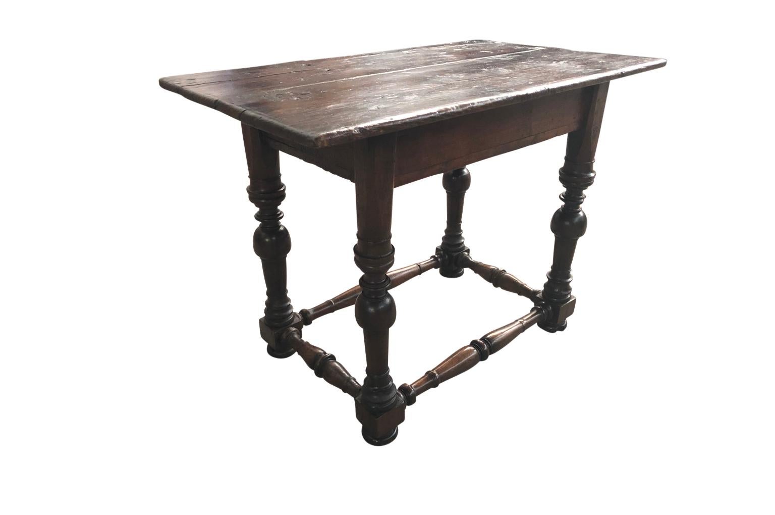 A very handsome Louis XIII style side table, console from Northern Italy. Nicely constructed from richly stained pine with beautifully turned legs and stretchers. Wonderful patina, rich and luminous.
