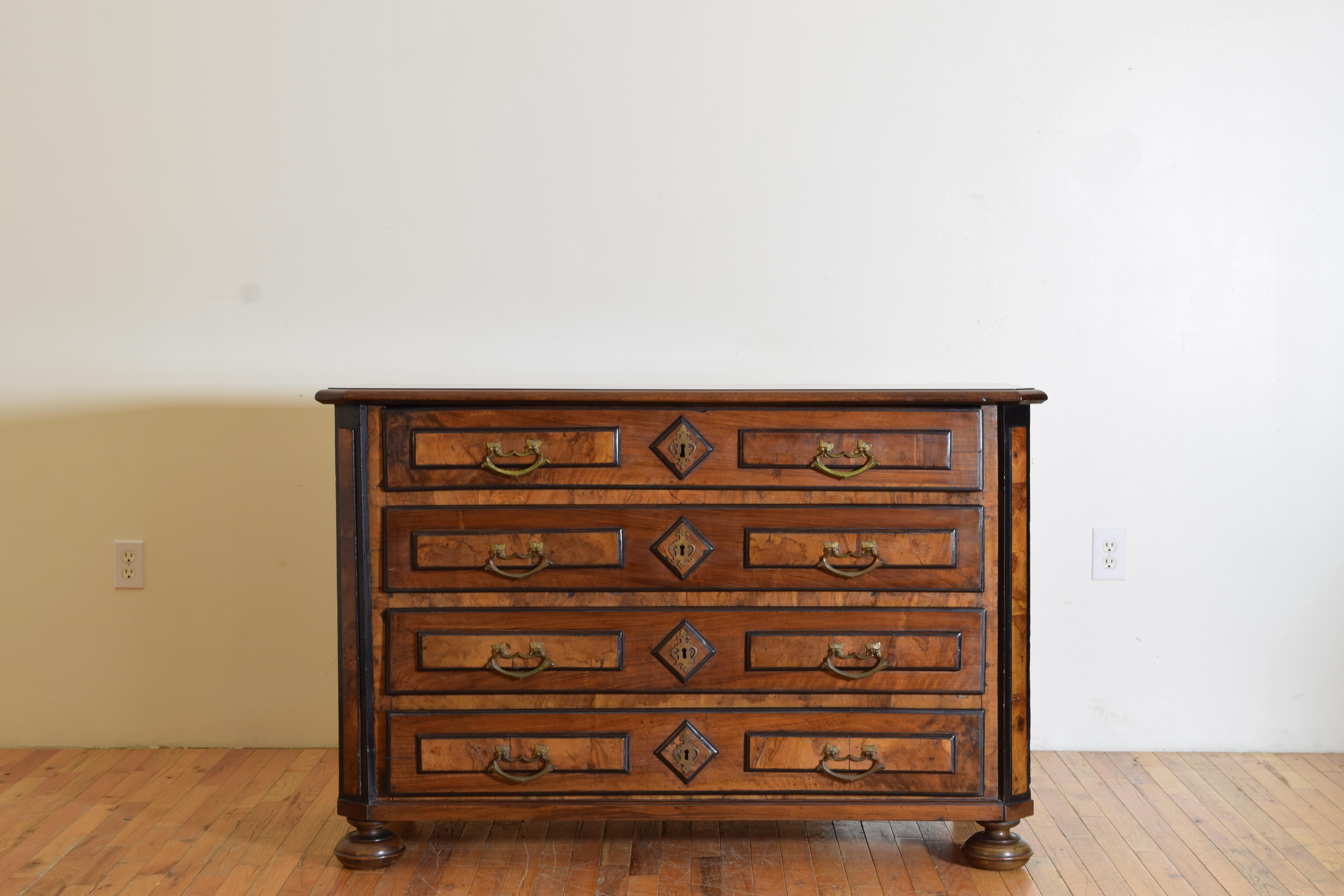 having a rectangular top with edge molding and slightly canted corners atop a confornming case housing three drawers with original antique hardware, the drawers, corners, and sides all with burl walnut veneers, the sides also with large star inlays,