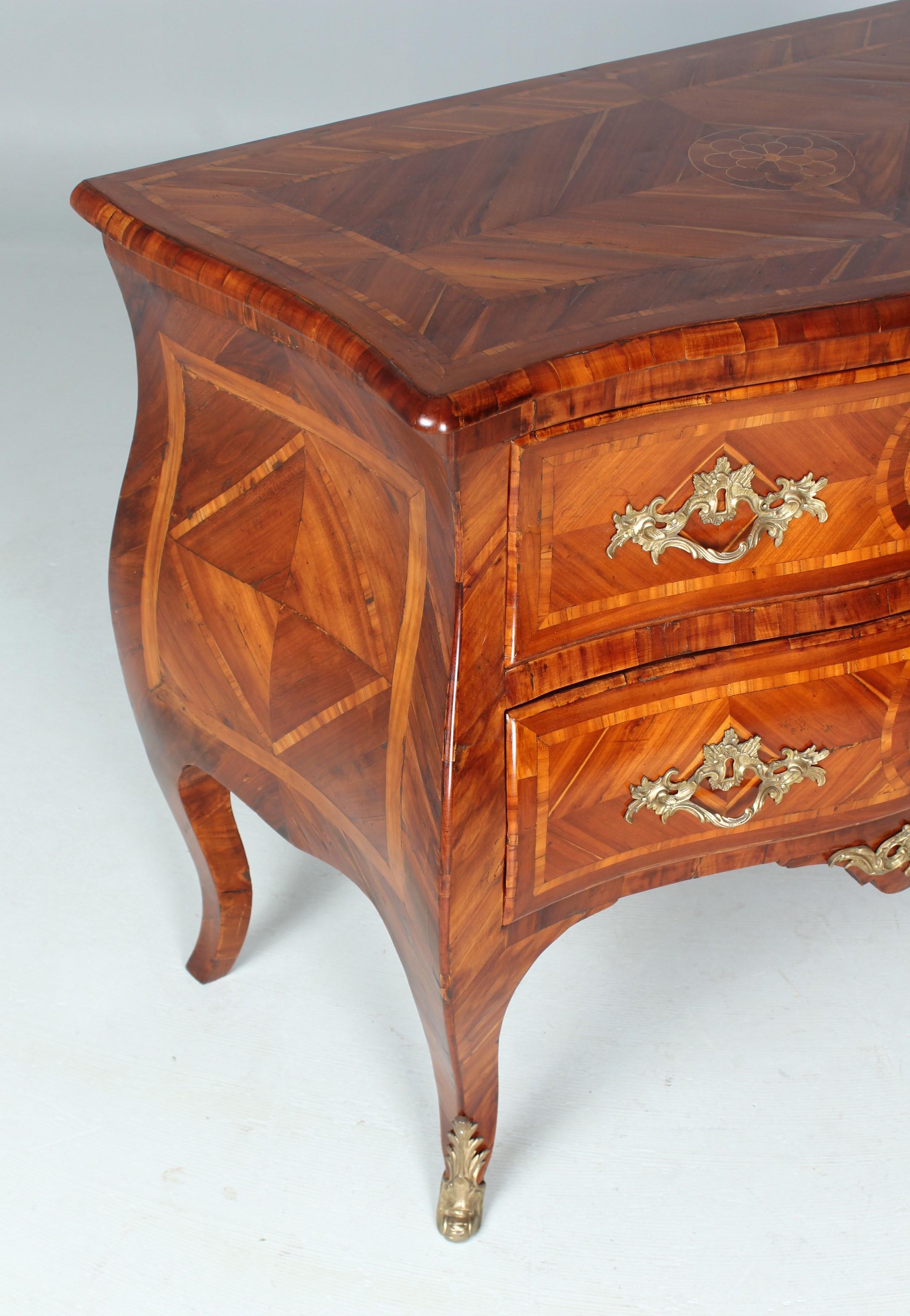 Italian baroque chest of drawers

Naples
plum wood (?)
Baroque around 1750

Dimensions: H x W x D: 85 x 101 x 53 cm

Description:
Two-bowl piece of furniture standing on curved legs.
All sides curved and cambered corpus. Veneered in plum