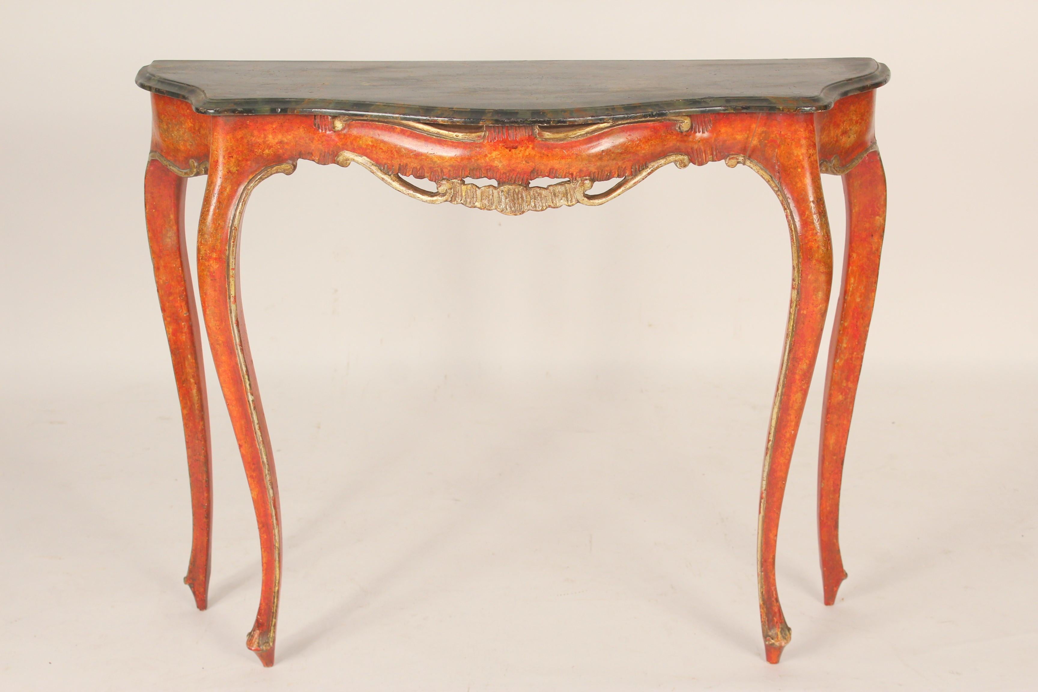 Italian Louis XV style red painted console table with gilt wood trim and a faux marble (wood painted to look like marble) top, circa 1930-1950.