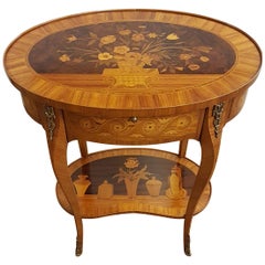 Oval table in Louis XVI style with rich inlay in rosewood and bronzes  1950s