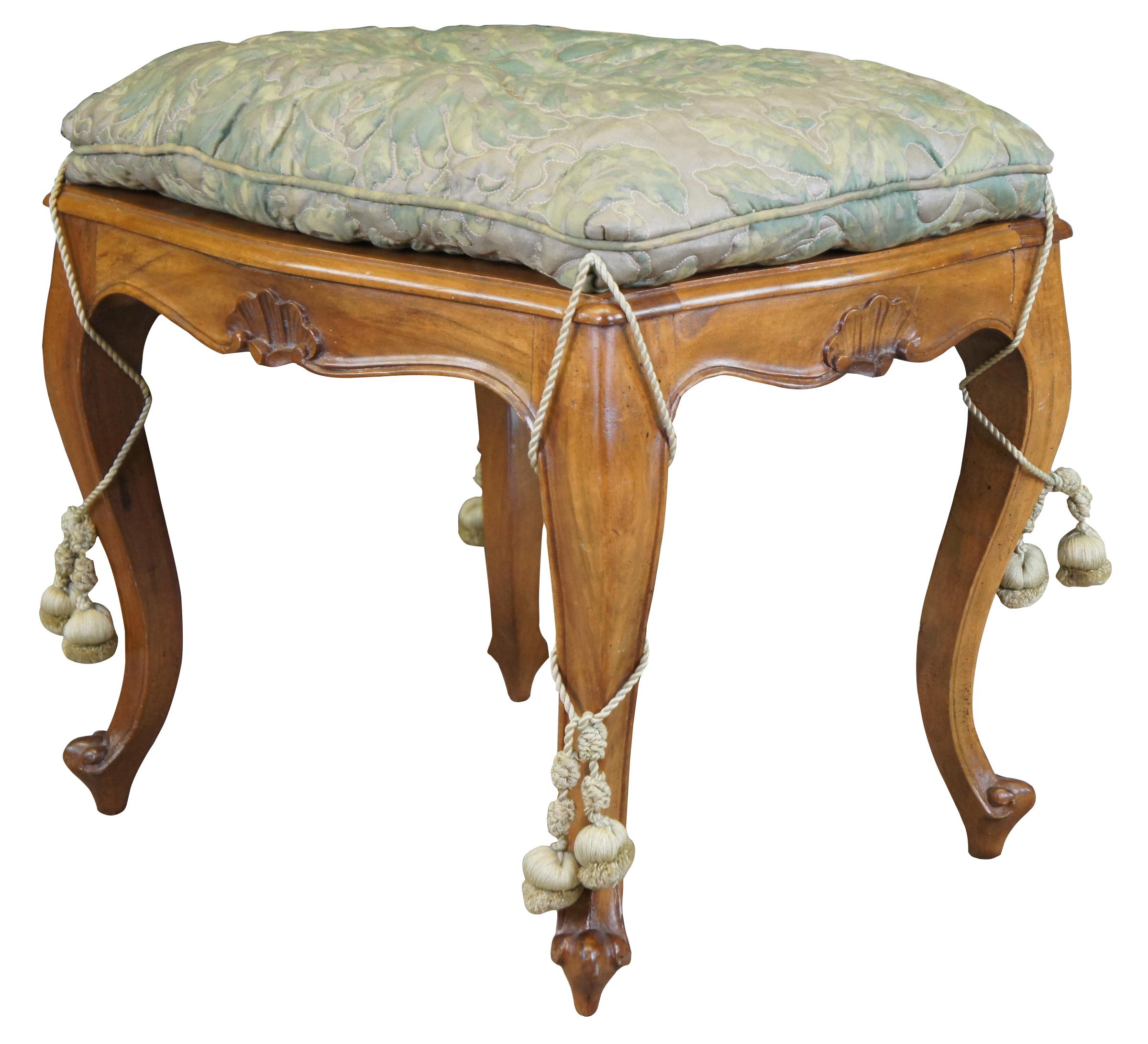 Vintage Italian Louis XV style bench seat, foot stool, ottoman or pouf. Made of walnut featuring serpentine form with caned seat, shell accents and cabriole legs. Includes upholstered cushion with tassels. Made in Italy.
 