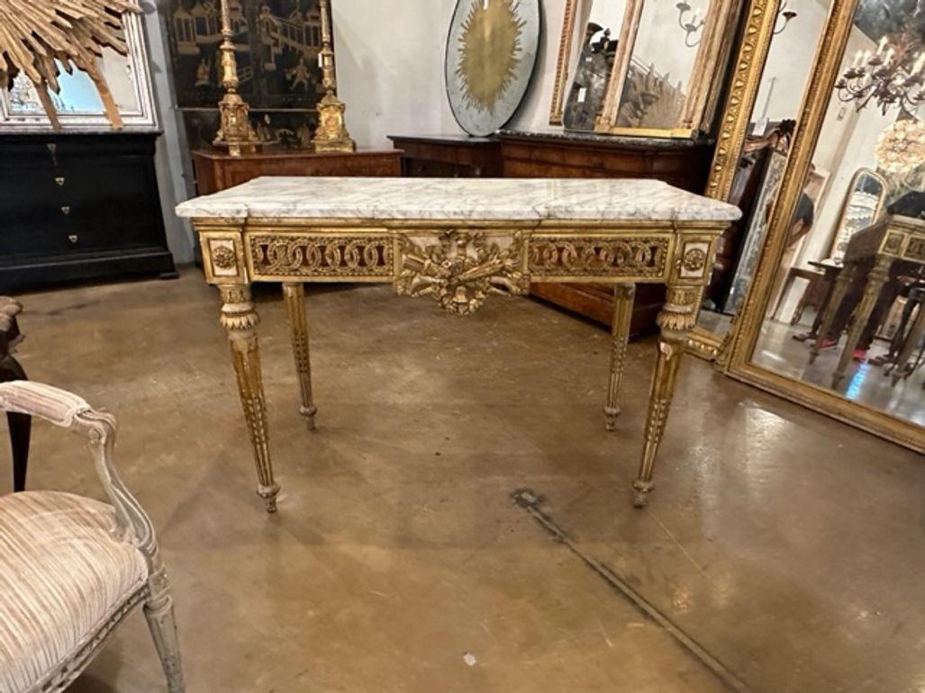 Outstanding 18th century Italian Louis XVI design carved and parcel gilt console with original Carrara top. Circa 1780. A favorite of top designers!