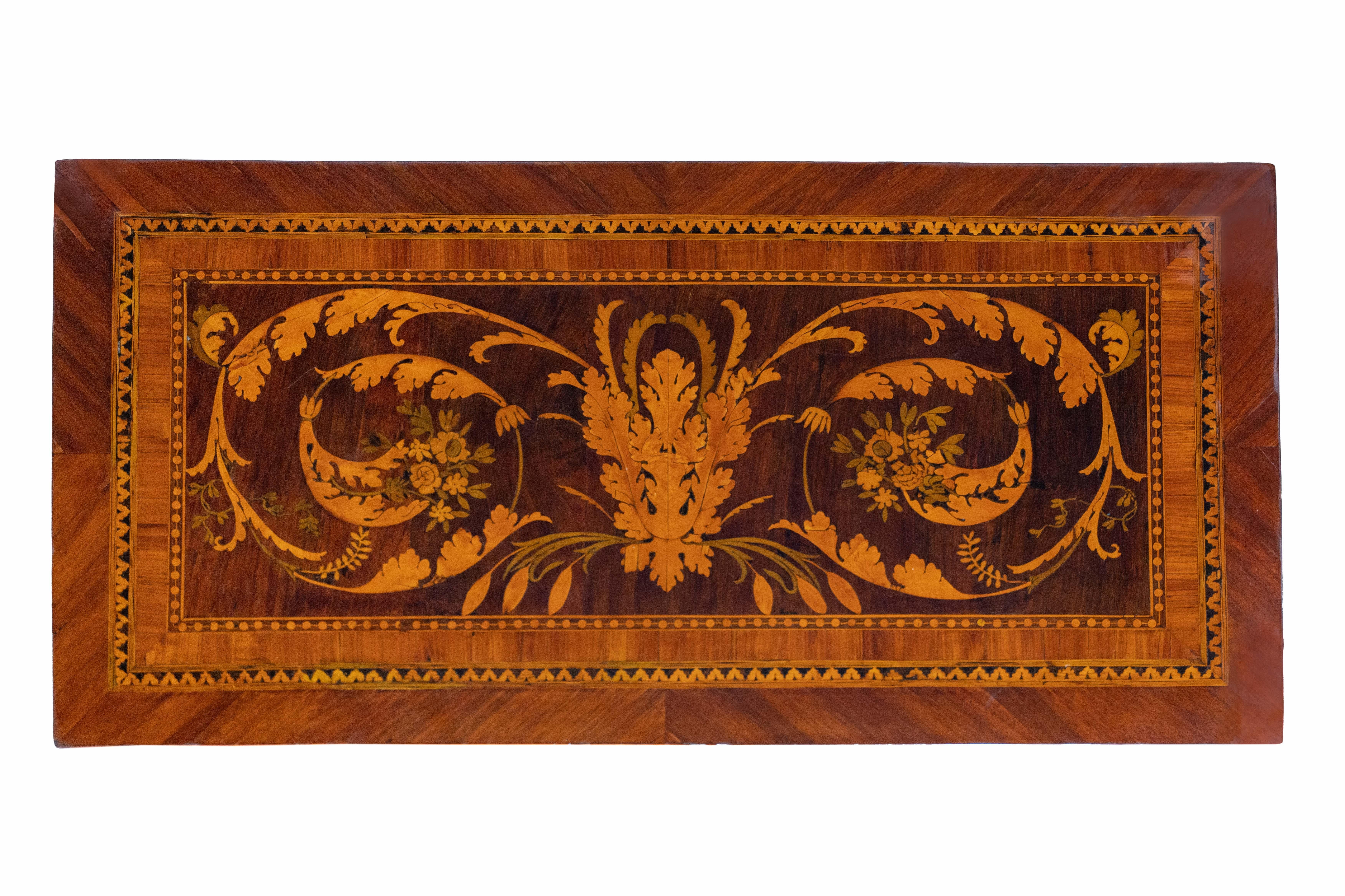 Extraordinary wooden game table finely inlaid on the top, on the front, on the back and along all four truncated pyramidal legs.

The top, also finely inlaid, opens concealing an internal top covered with green leather cloth enclosed within a walnut
