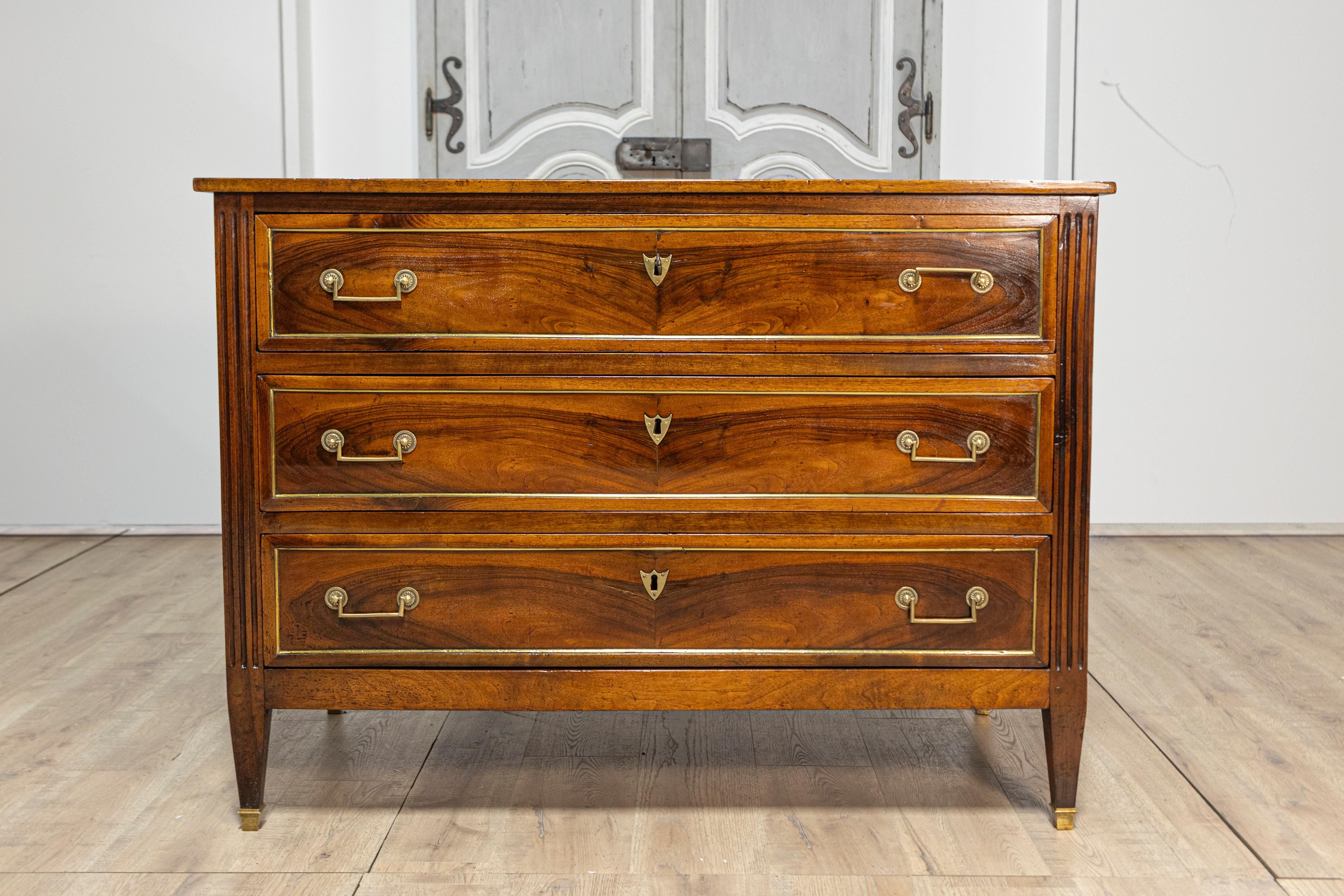 Carved Italian Louis XVI Late 18th Century Walnut Three Drawer Commode with Brass Trim For Sale