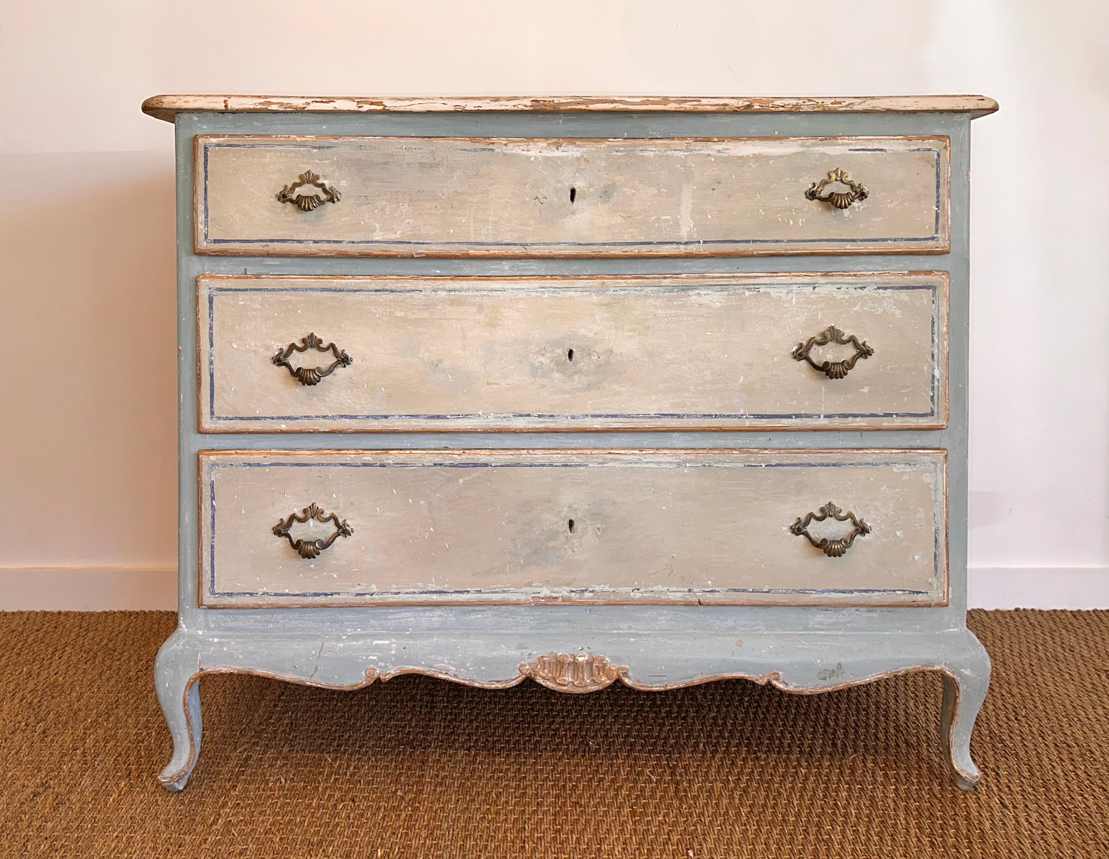 Delightful painted Italian chest in the Louis XVI Style.  very early 19th c.  Highly decorative.   Cream painted drawers with blue and gold border detailing.  Pale blue frame with gold details.  Cream top matching drawers and side panels.  