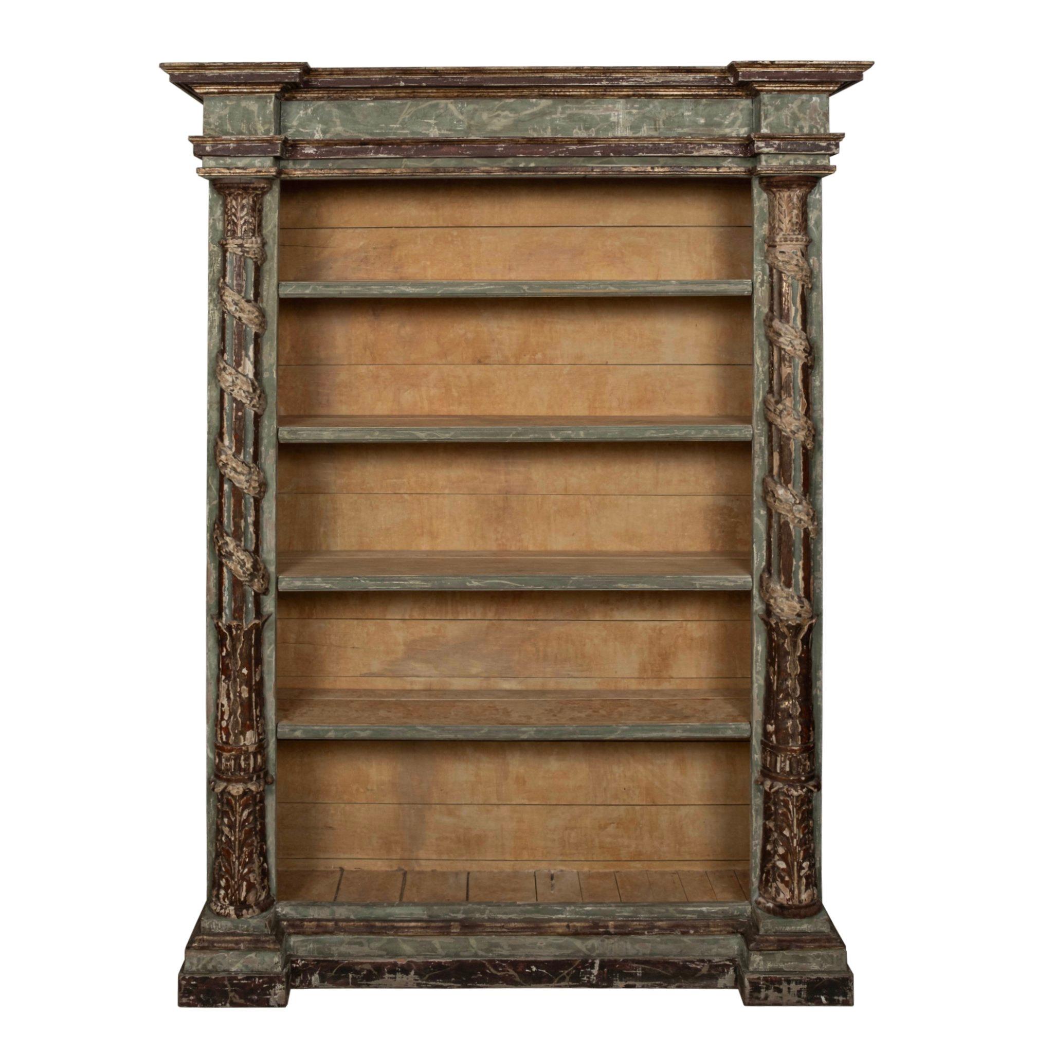 A beautiful and stately Louis XVI style gessoed and polychromed bookcase made with 18th century architectural fragments.