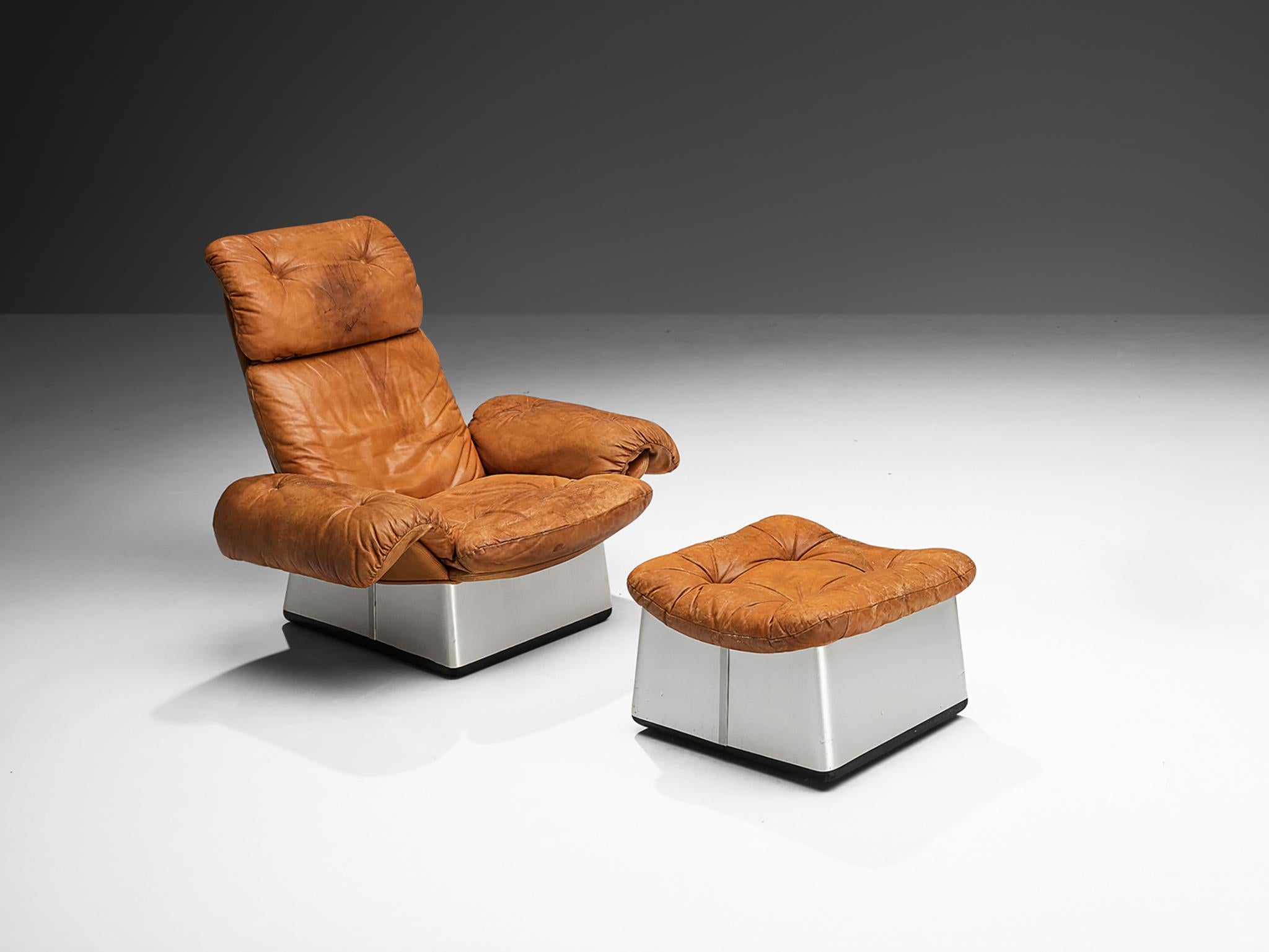 Lounge chair with ottoman, leather, aluminum, Italy 1970s

A set consisting of a lounge chair and ottoman made in Italy in the 1970s. This chair strongly represents the essence of furniture design of the 1970s, going beyond the strict conventions of