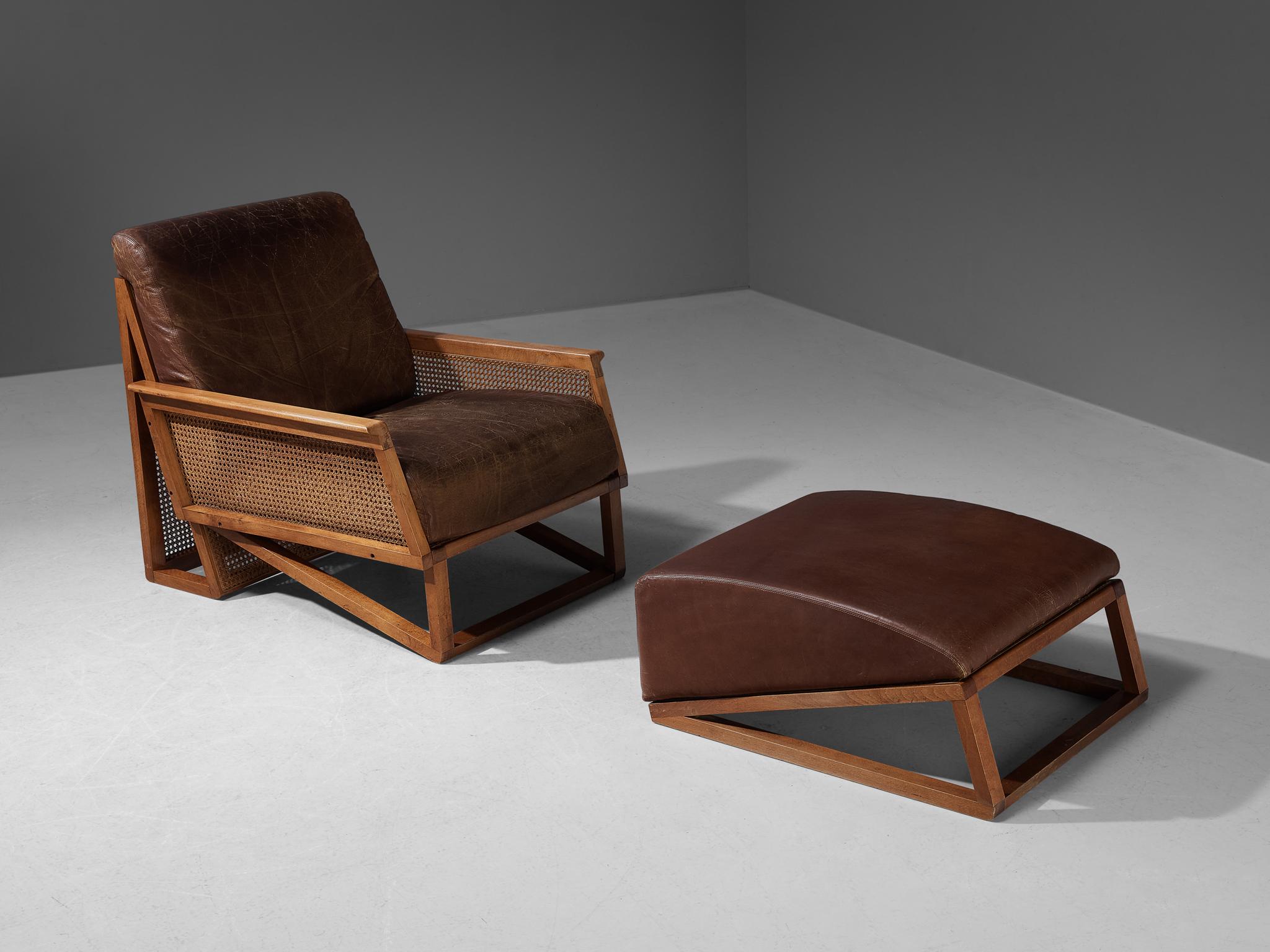 Lounge chair and ottoman, beech, cane webbing, leather, Italy, 1970s

This beautiful lounge chair and ottoman is made in Italy in the 1970s. Made in a geometrical and elegant way, this piece is easy to envision in a library or sun room. The