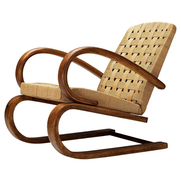 https://a.1stdibscdn.com/italian-lounge-chair-with-bentwood-frame-in-plywood-and-rush-for-sale/f_9331/f_371323821700217691056/f_37132382_1700217691500_bg_processed.jpg?width=768