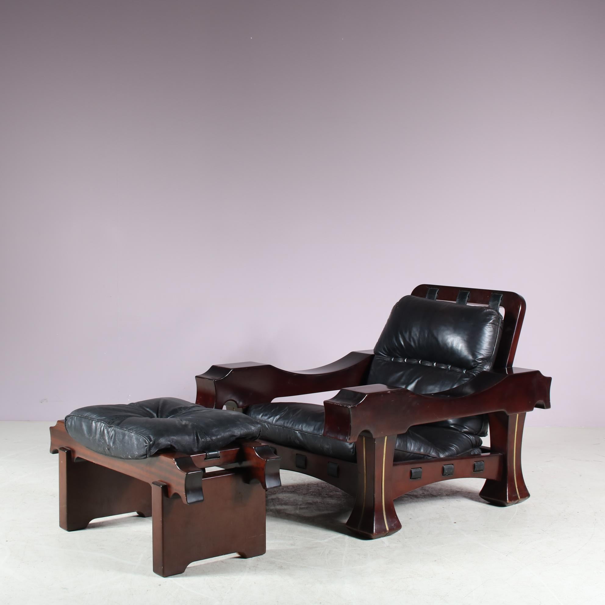 An eye-catching lounge chair designed by Luciano Frigerio, manufactured in Italy around 1970.

The deep brown color of the mahogany wood fits this eye-catching set really well. The cushions of the chair and stool are all upholstered in high