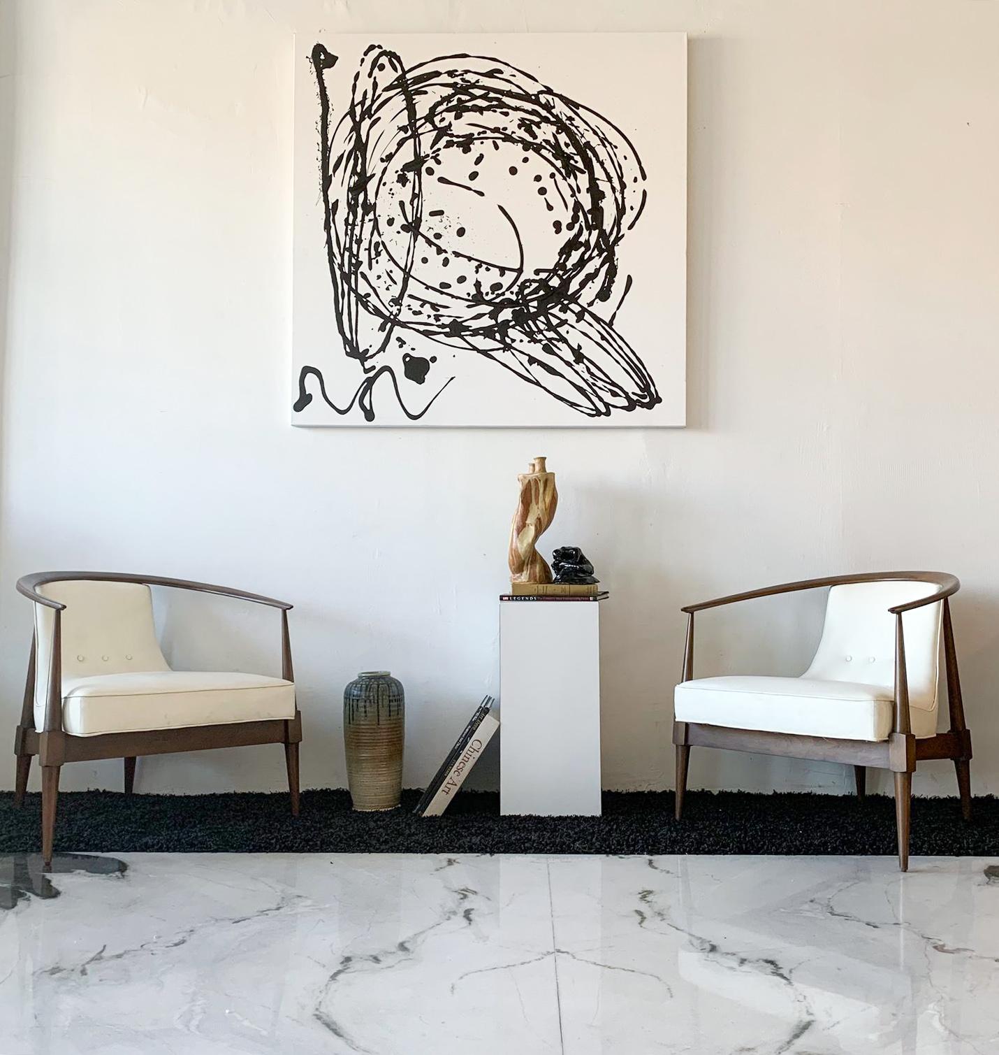 Available right now I have this stunning pair of lounge chairs, a design attributed to Silvio Cavatorta. These stunning Italian lounge chairs are clad in their original white vinyl upholstery and original walnut frames. They are both easy on the