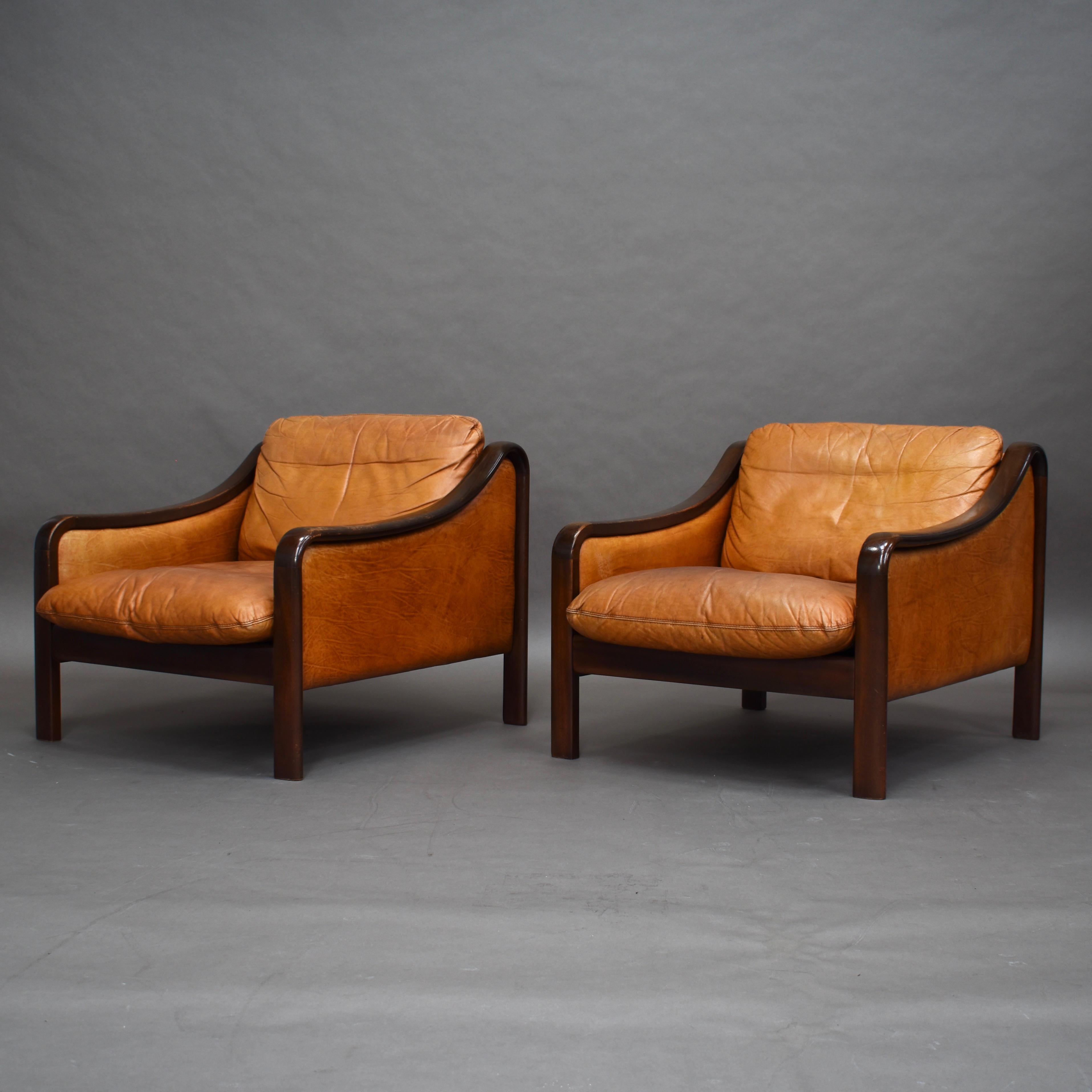 Pair of Italian club lounge armchairs in Cognac colored leather and stained beechwood.
Price is per chair.

Designer: Unknown

Manufacturer: Unknown

Country: Italy

Material: Leather / Stained wood

Design period: 1950s

Date of