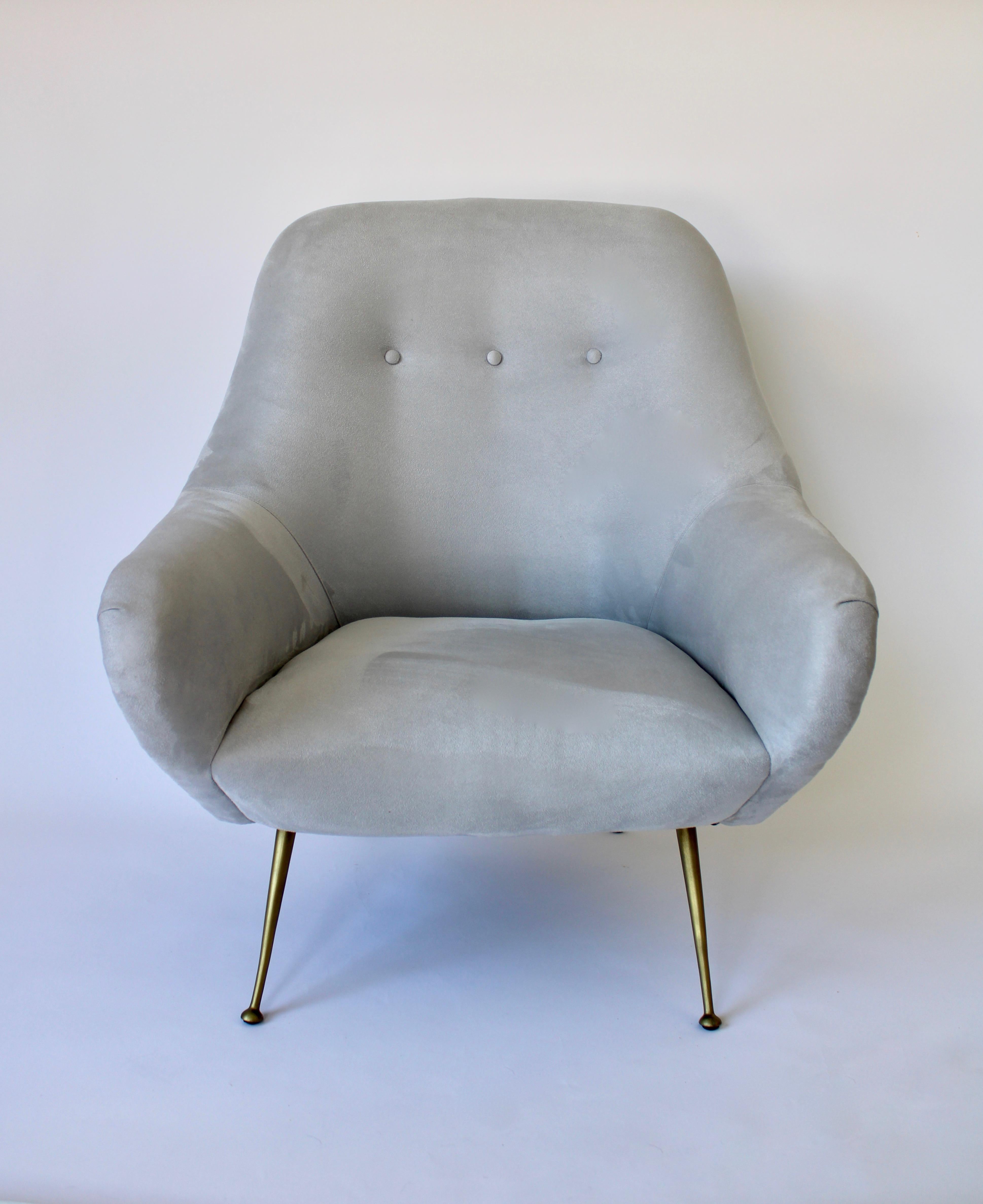 Pair of Italian lounge chairs in the style of Gigi Radice and some characteristics of Marco Zanuso.
The chairs have been reupholstered in light gray ultra-suede on the interior with a tufted back.
The exterior of the chairs are reupholstered in a