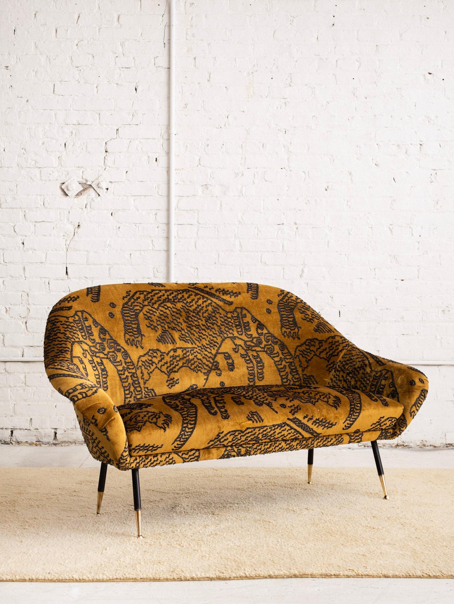A mid century Italian loveseat or settee attributed to Gastone Rinaldi for Rima. Newly upholstered in 