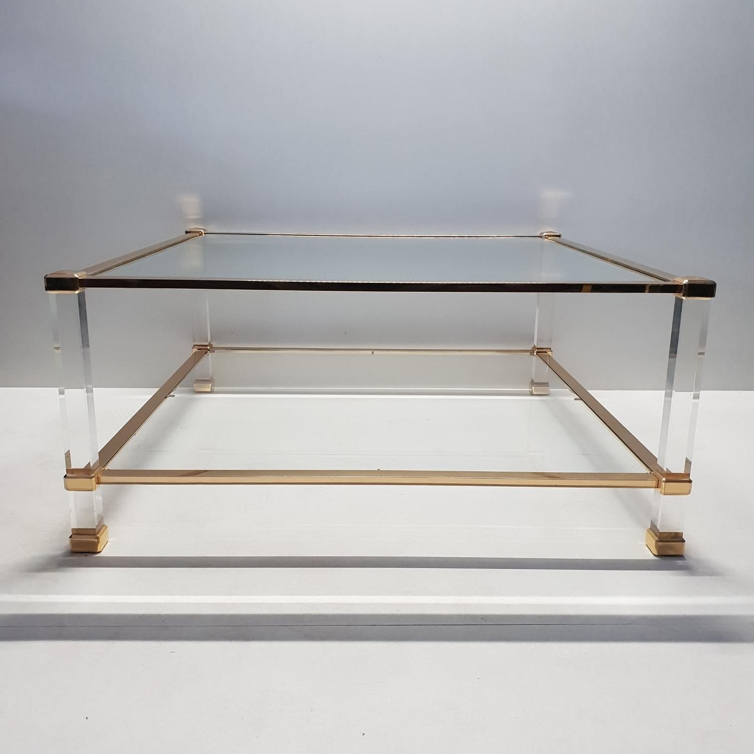 Italian Lucite and brass square coffee table by Orsenigo, 1970s
Unique.

Orsenigo Furniture History - The company was founded in 1960 in Italy by the Orsenigo family, and continues to operate today north of Milan. The high end furniture combines