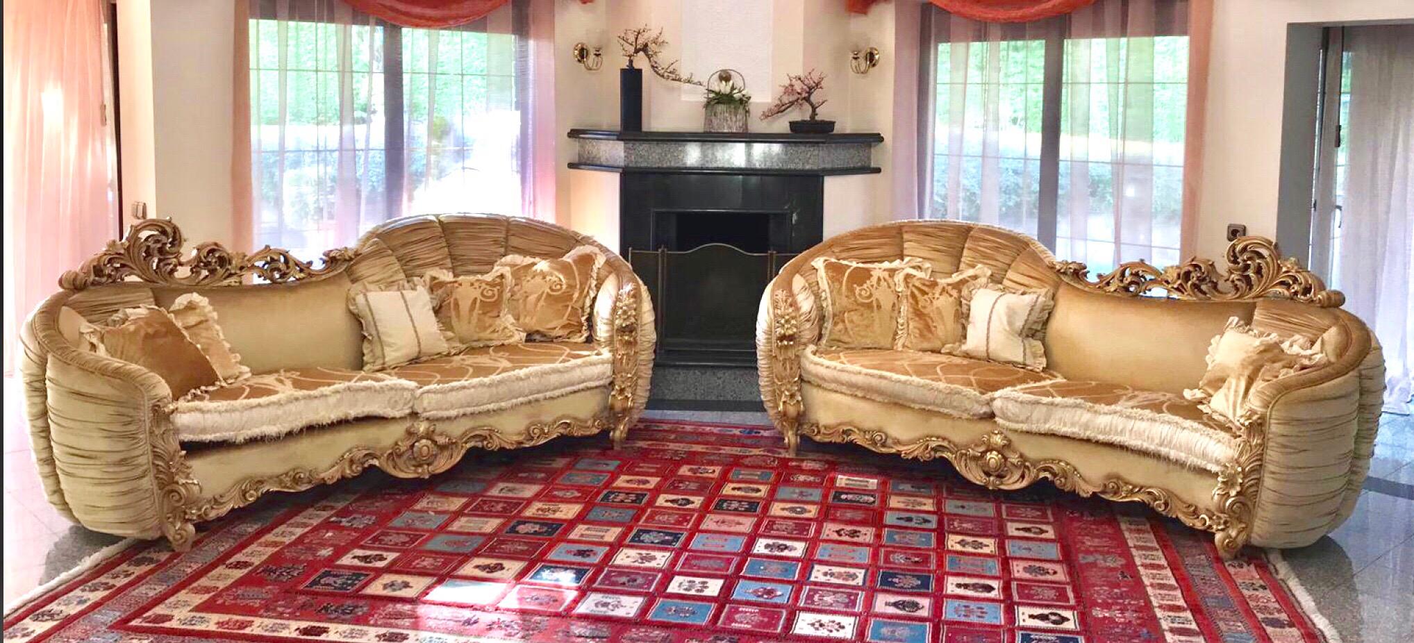 Set of two luxury three seated asimmetrical sofa by Italian luxury brand Riva Mobili D'Arte.
Made of handcrafted and hand painted massive wood and luxury textile this furniture have unique style and shape. They have been made in 2012 and were used