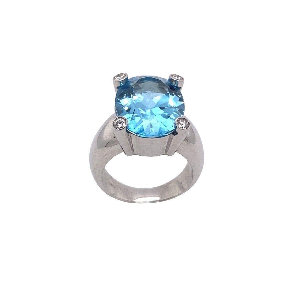 Round Cut Italian Made 7.0ct Oval Facetted Blue Topaz Ring with a Diamond on Each Corner For Sale