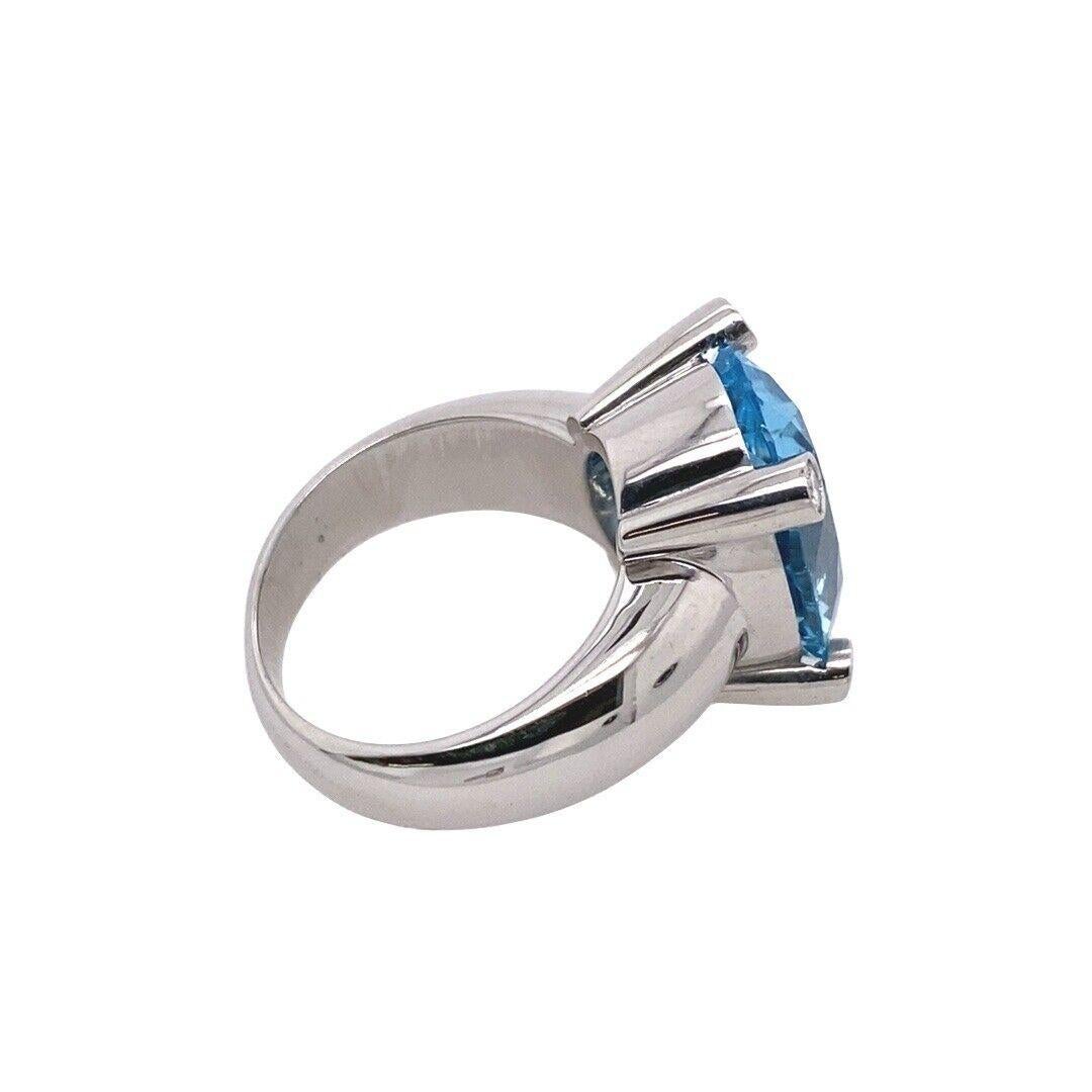 Women's Italian Made 7.0ct Oval Facetted Blue Topaz Ring with a Diamond on Each Corner For Sale