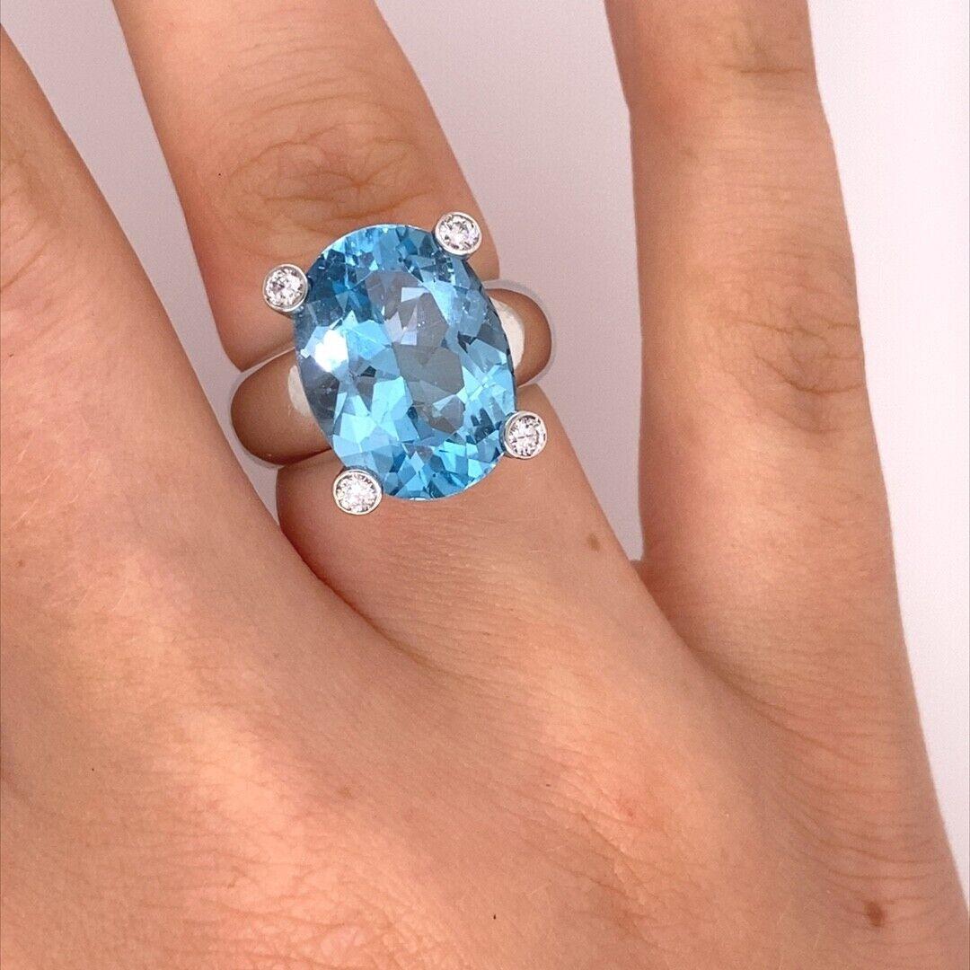 Italian Made 7.0ct Oval Facetted Blue Topaz Ring with a Diamond on Each Corner For Sale 1