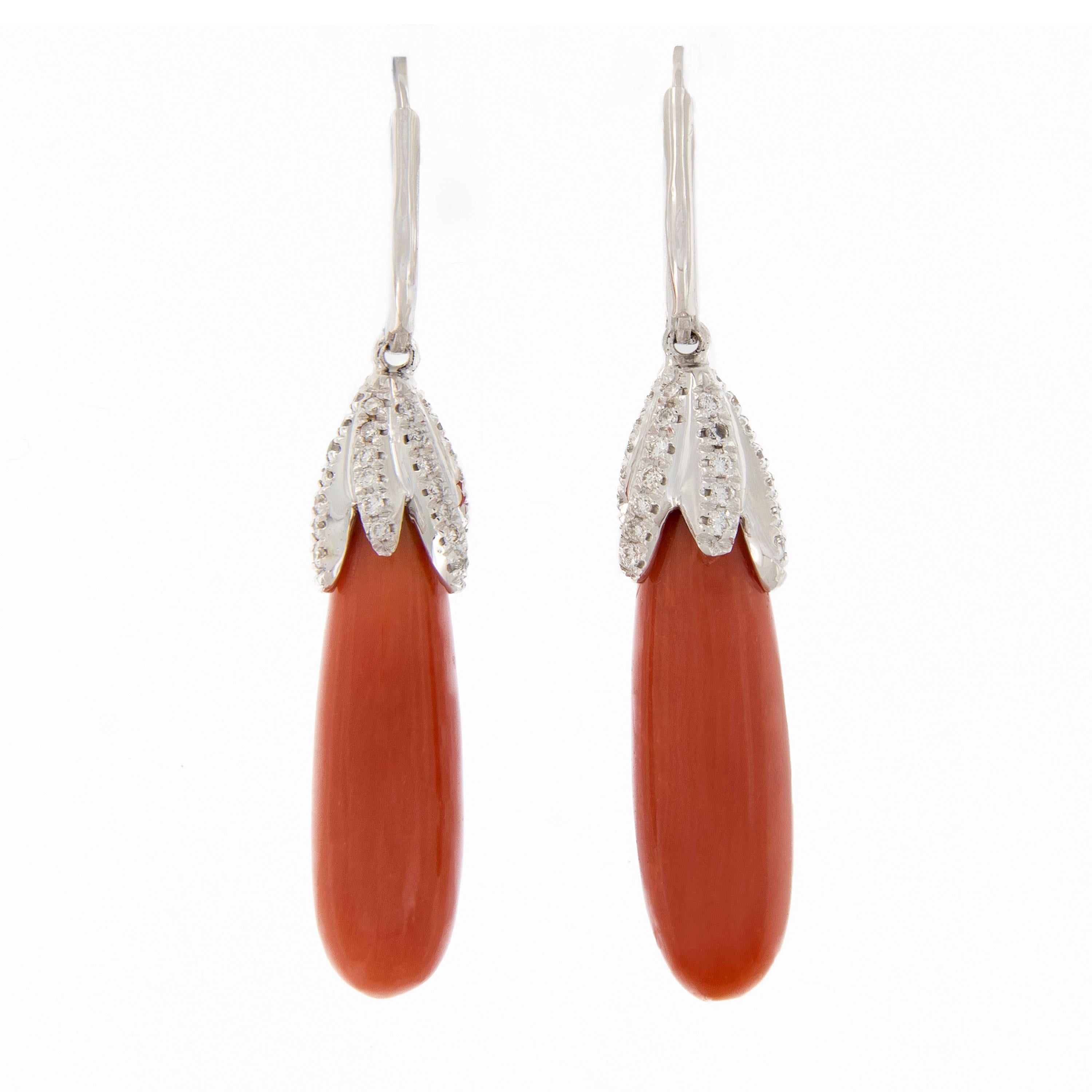 Beautiful natural coral dangle from 18K white gold huggy-style earring accented with diamonds. Handcrafted in Italy. 1.73 inches long. Weigh 11.3 grams. 

Diamonds 0.80 cttw