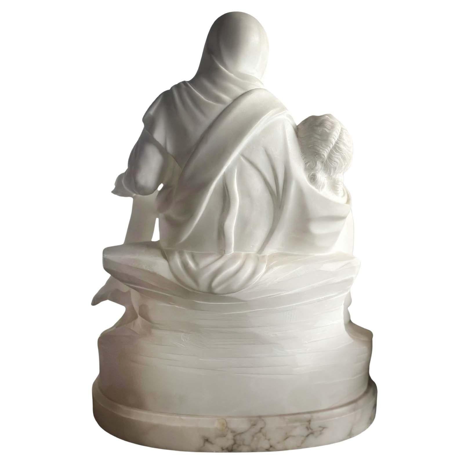 Reverent white marble sculpture after Michelangelo's eminent 'Madonna della Pietà', depicting the Virgin Mary holding the lifeless body of her son, Jesus Christ. It captures the strength of maternal love and the profound sorrow she must have