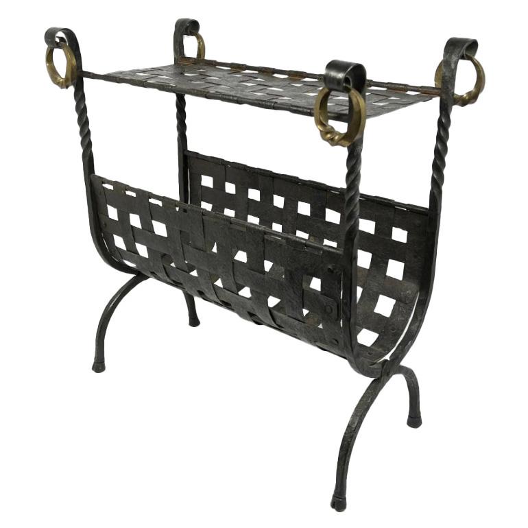 An exquisite piece of functional art that effortlessly blends utility with elegance – a bespoke magazine holder and drink table. Crafted with exceptional attention to detail, this unique piece features an intricate design of woven iron straps,