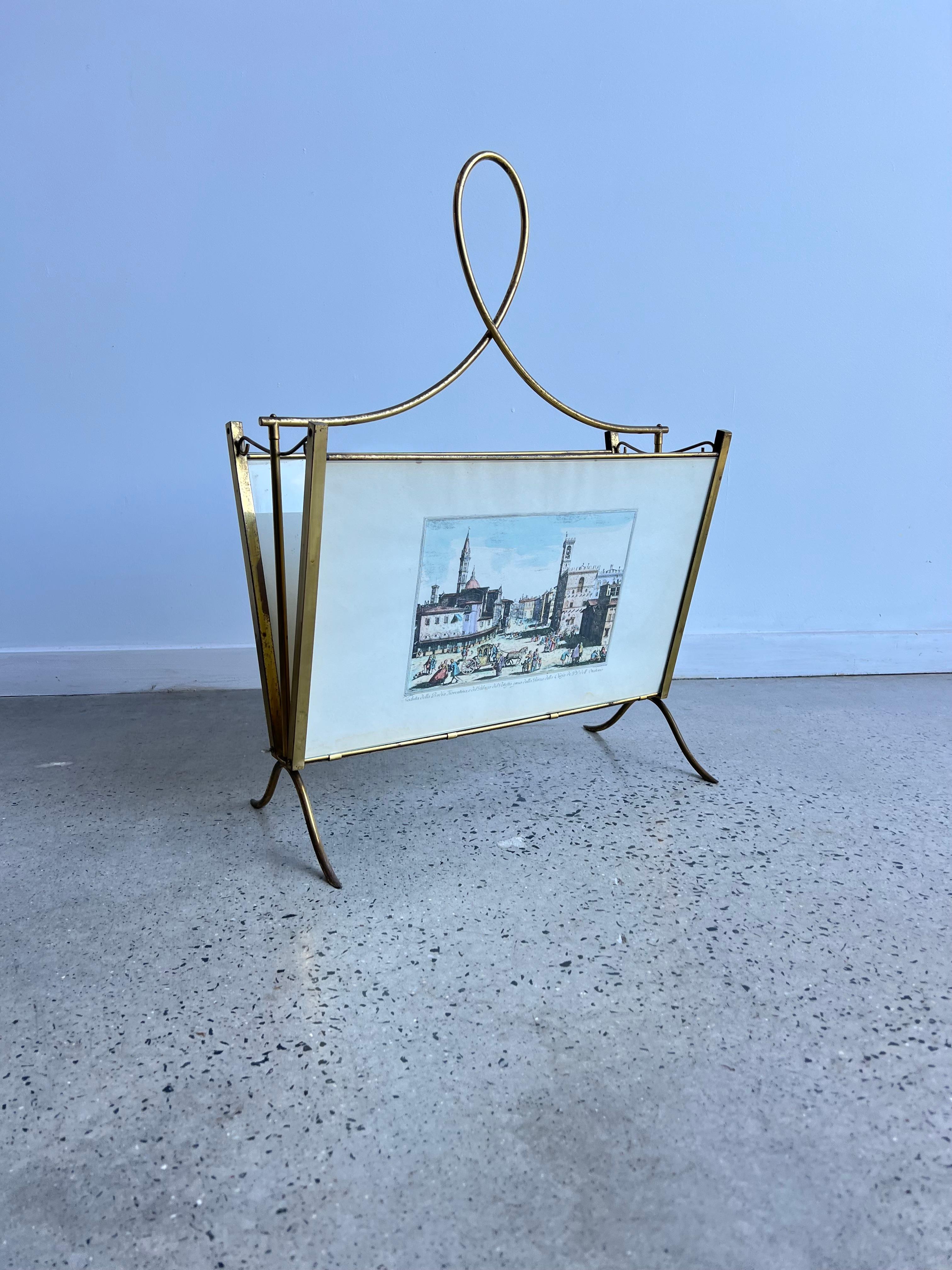 Magazine holder brass and glass, Image of Florence Italy 1950s.
Magnificent magazine holder 1950s, very beautiful refine with glass in both sides holding 2 different images of Florence city center during the era.
  