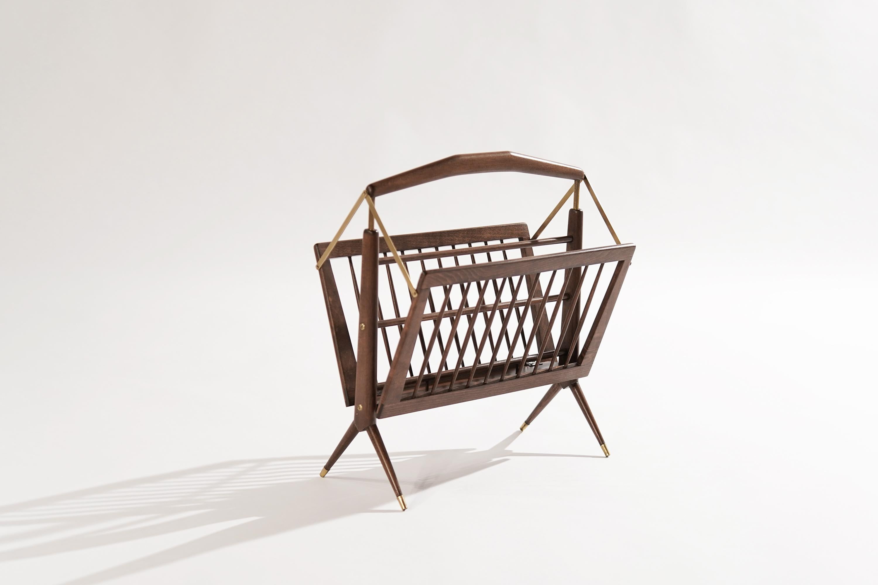 Stunningly beautiful magazine rack or stand in the style of Gio Ponti, featuring a walnut frame with brass accents. Original from Italy, circa 1950-1959.

Other designers working in the organic style include Carlo Mollino, Franco Campo & Carlo