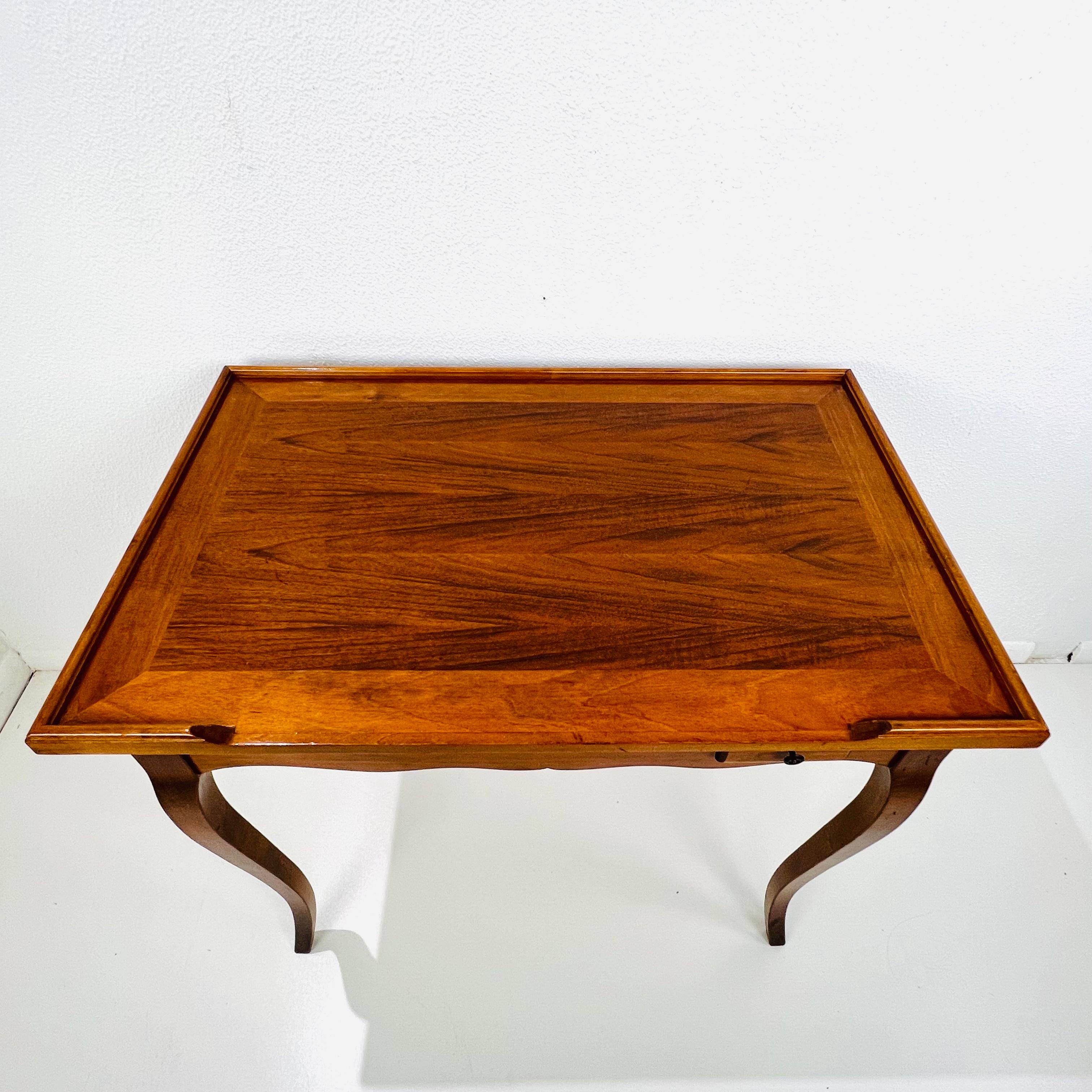 Stunning vintage Italian 3-way game table with reversible flip top featuring one plain side and one side decorated with an inlaid checkerboard. Table top removes to display a storage space with backgammon table. Includes one drawer for additional