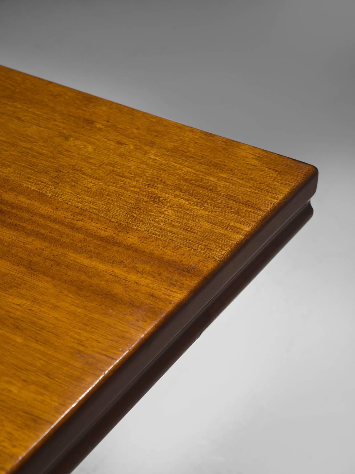 Dining table, in mahogany, Italy, 1940s

Large architectural table in patinated mahogany. The rectangular tabletop features detailed edges. The base of this table is made out of two curved ribbed legs. The slightly curved columns are decorated
